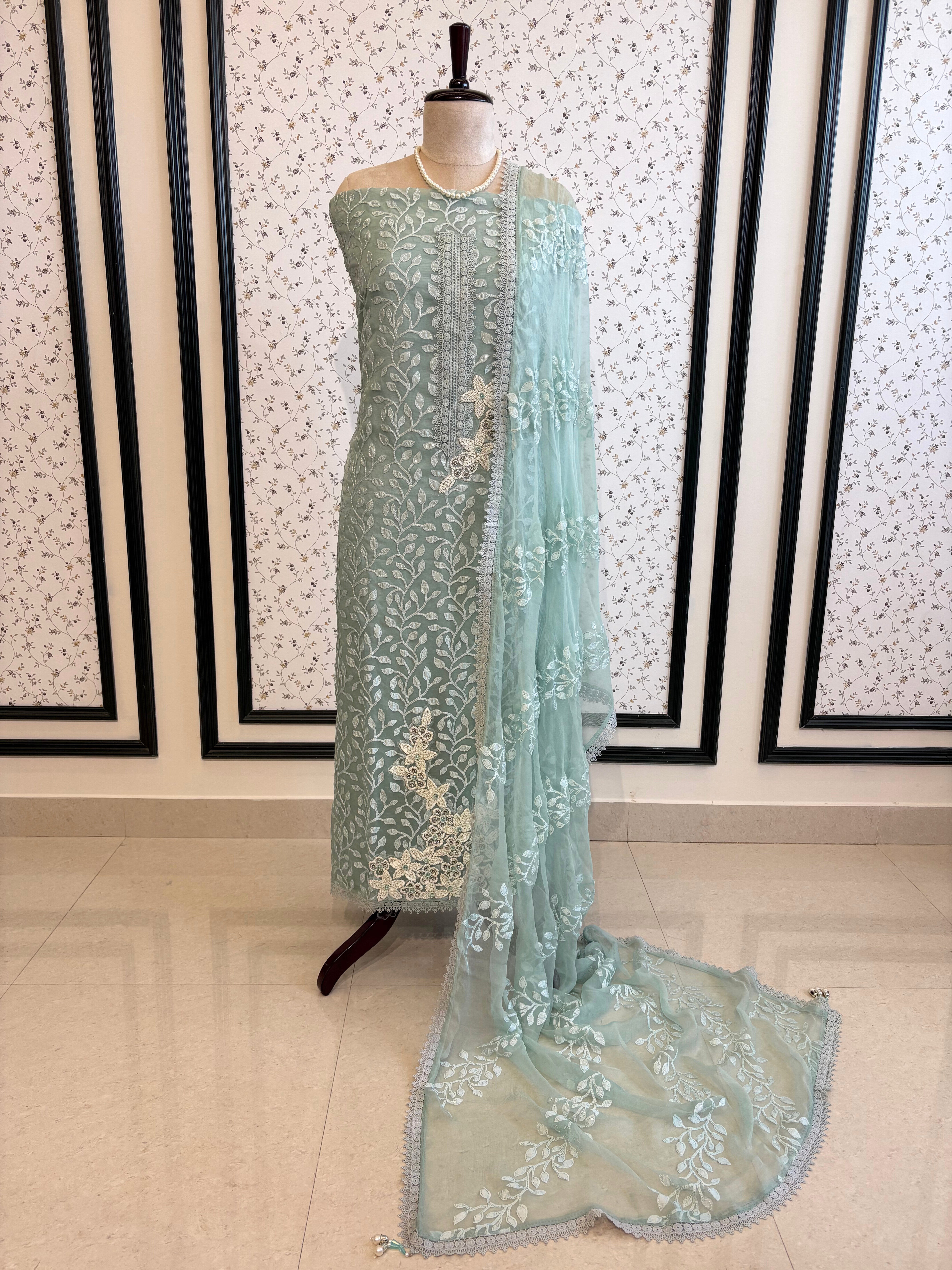 Pastel Green suit with applique embroidery and moti bead embellishments, paired with embroidered organza dupatta.