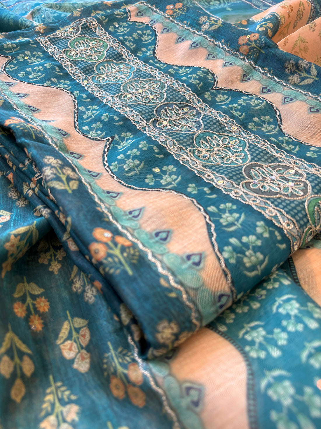 Teal green chanderi suit with golden weave and printed chanderi dupatta featuring tassel edging.