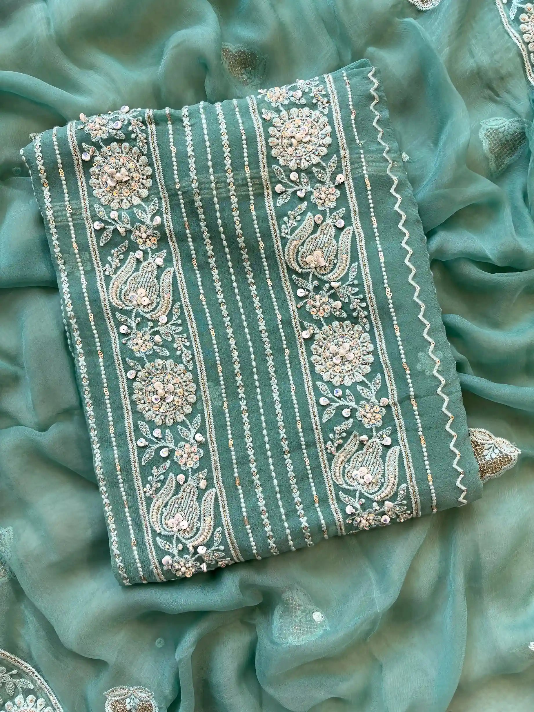 aqua green party wear chikankari unstiched suit with moti and sequence embellishments