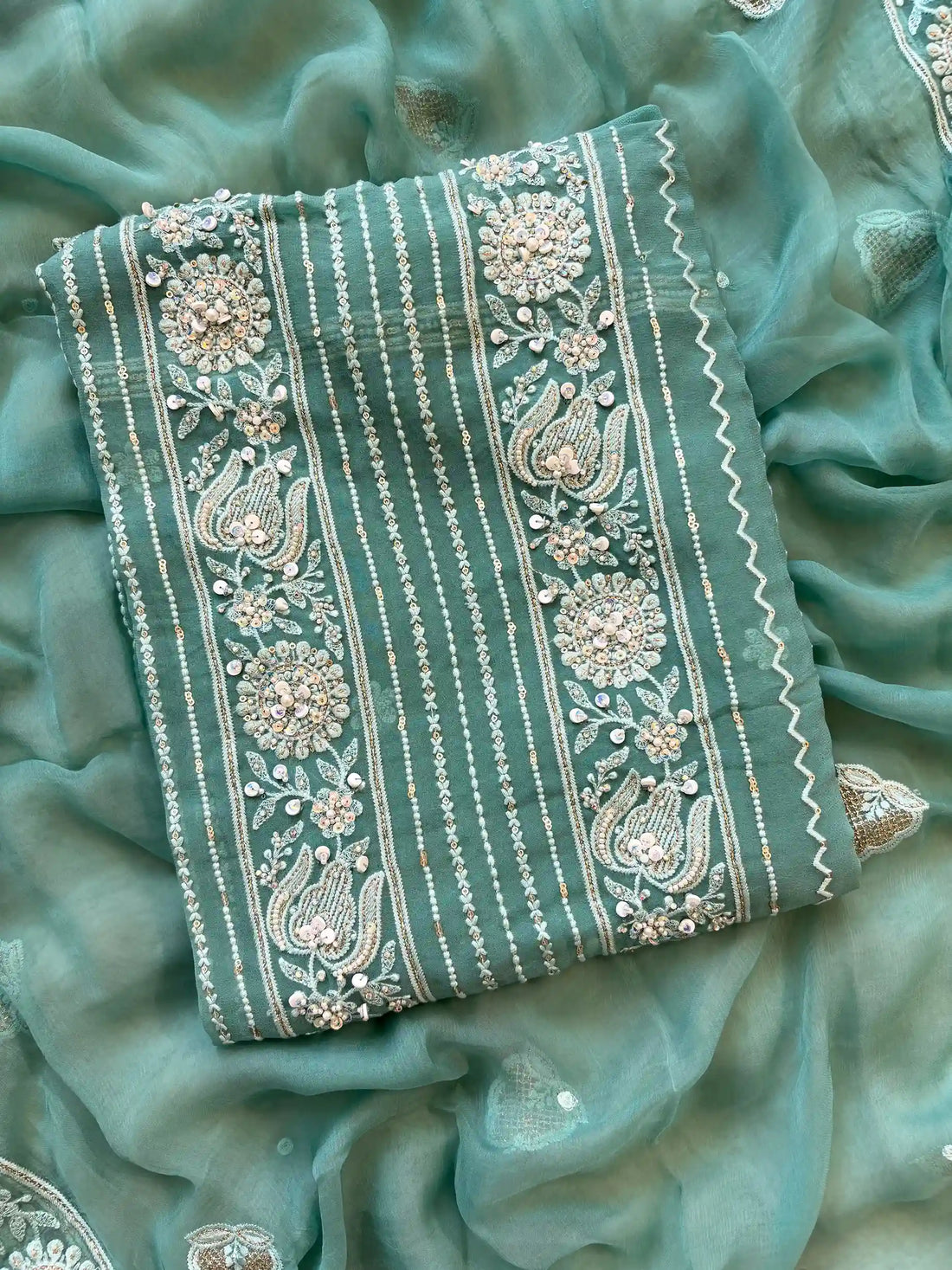 aqua green party wear chikankari unstiched suit with moti and sequence embellishments
