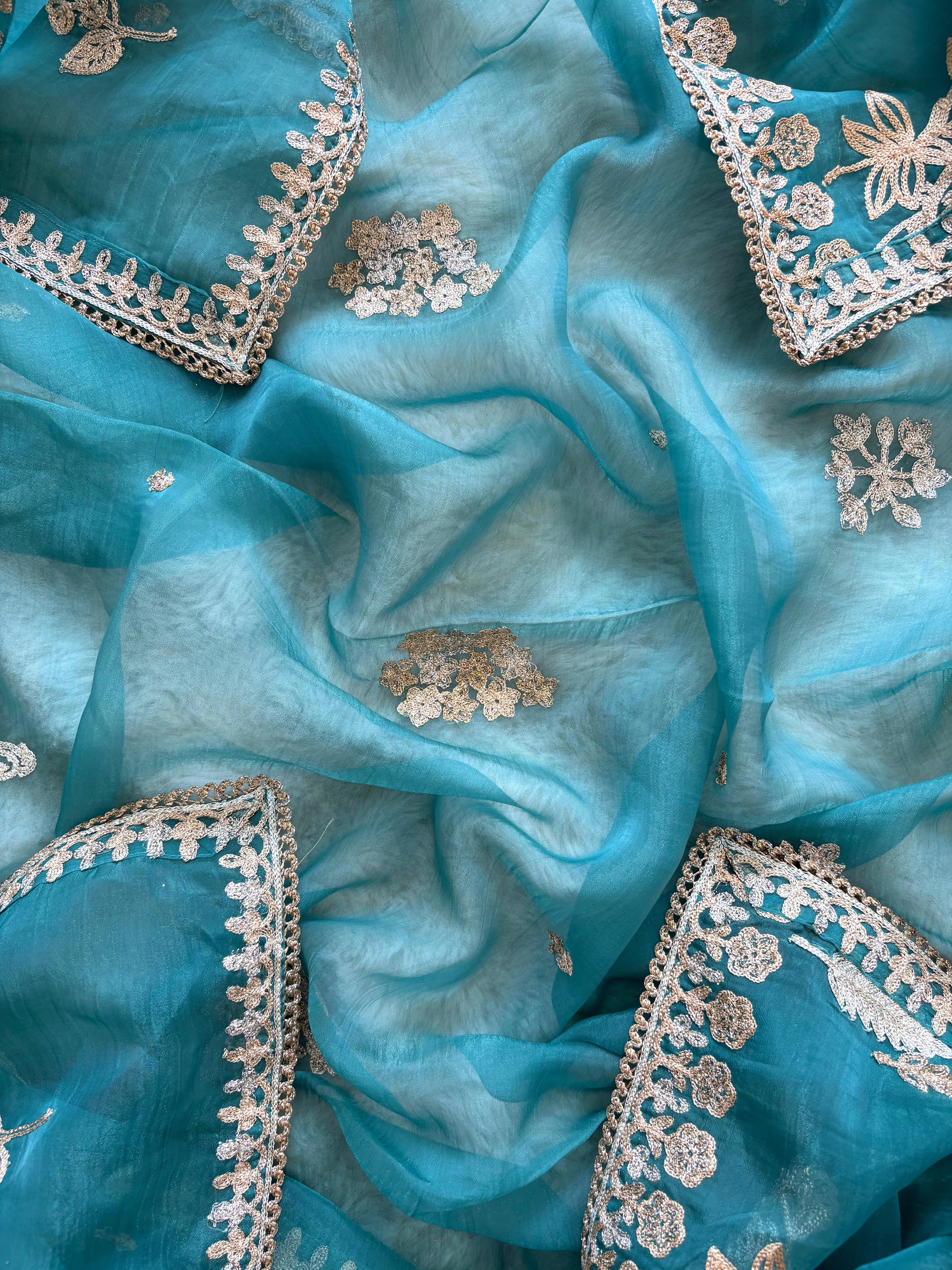 organza unstitched suit with zari work and parrot figure