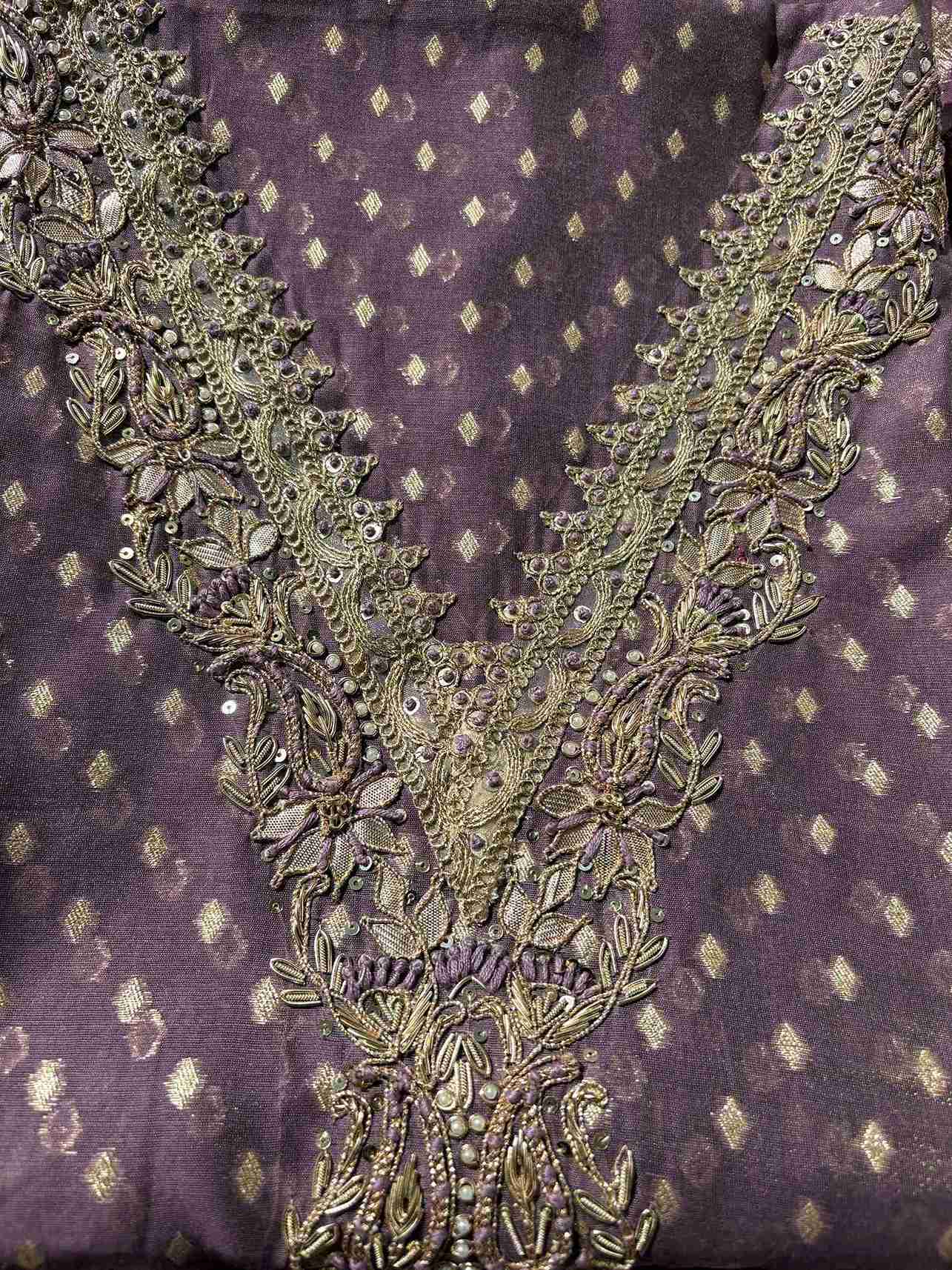 Detailed view of zardozi embroidered neckline on lavender organza suit fabric