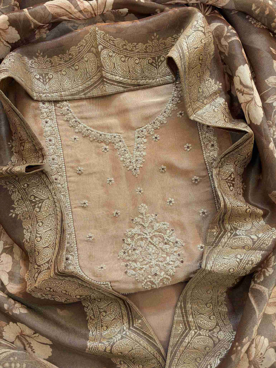 Gold organza unstitched suit with zari embroidered neckline and floral organza dupatta