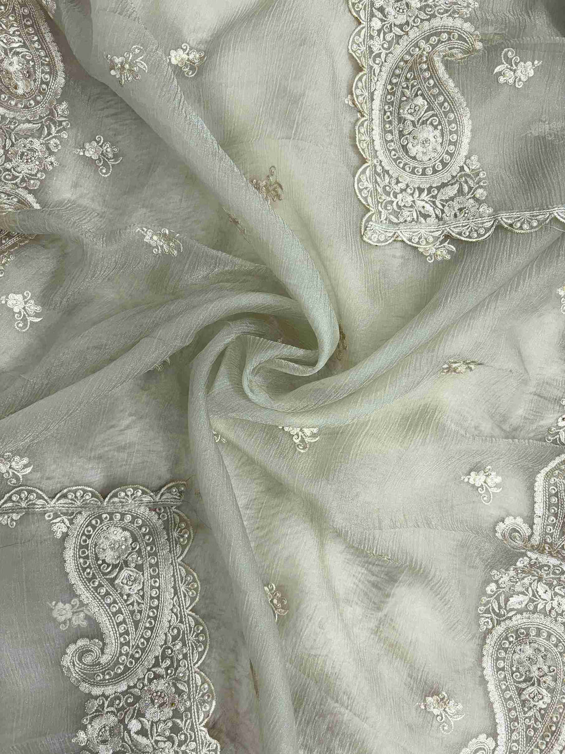 Paisley cutwork border with scalloped finishing along Green marble chiffon dupatta edge