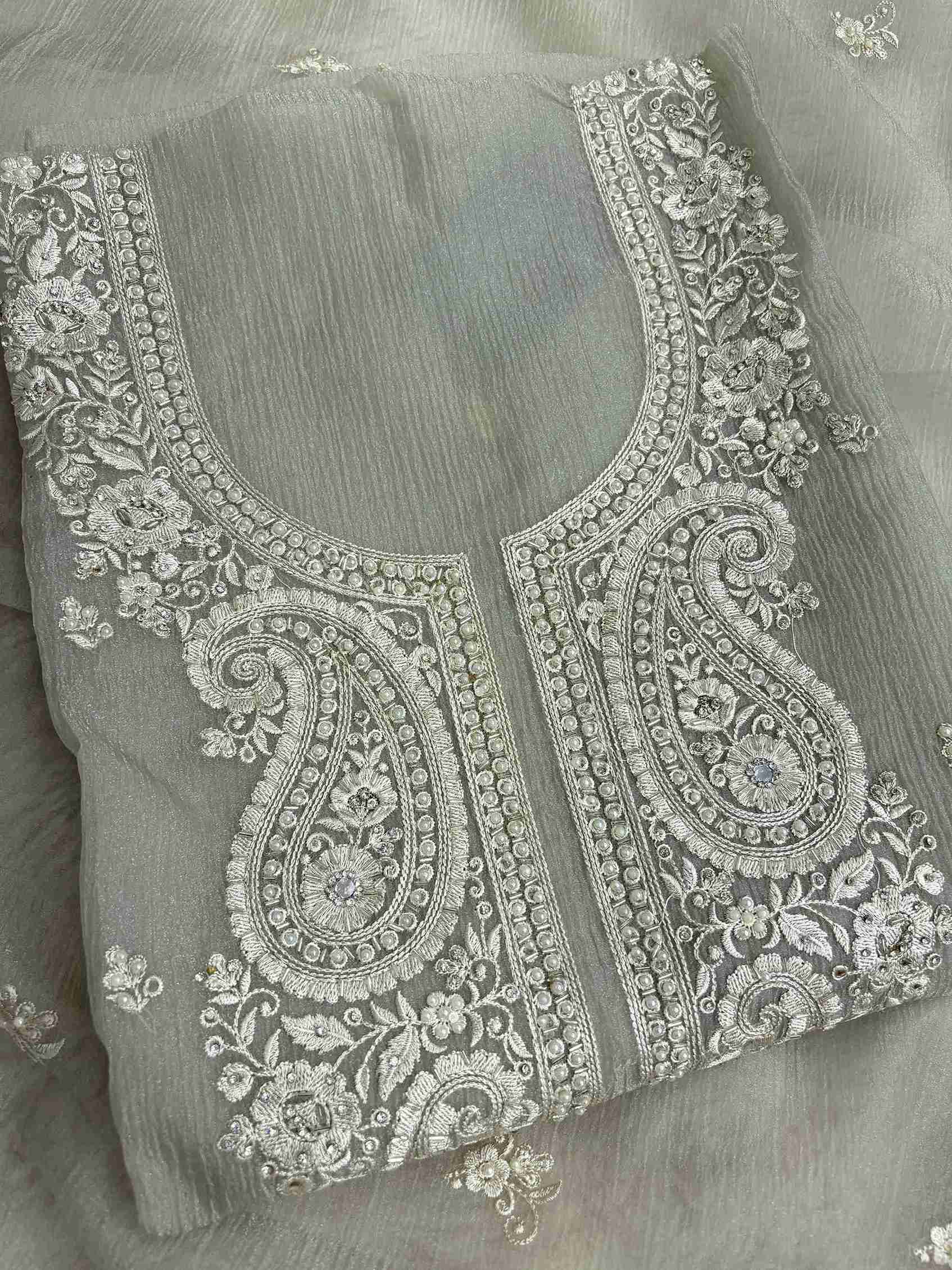 Scattered small floral motifs detail across the neckline of Green marble chiffon shirt