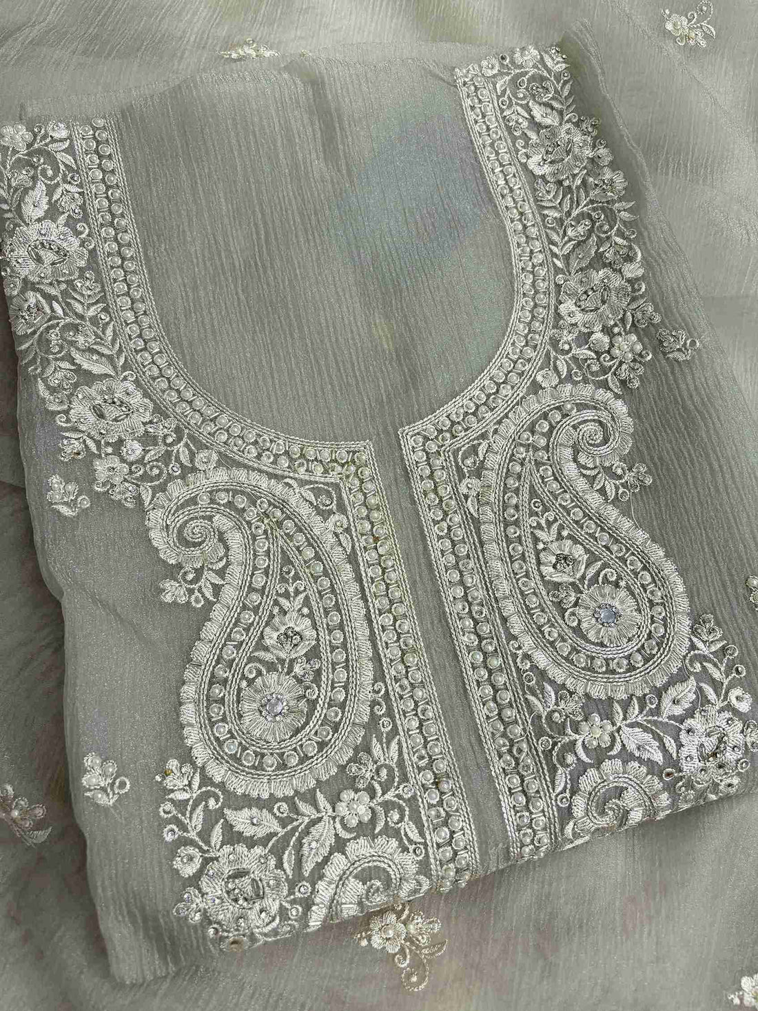 Scattered small floral motifs detail across the neckline of Green marble chiffon shirt