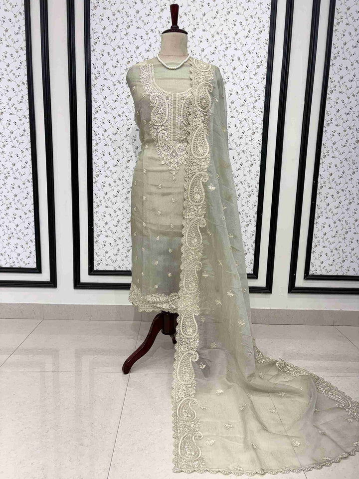 Green marble chiffon unstitched suit full front view with paisley cutwork dupatta draped on mannequin