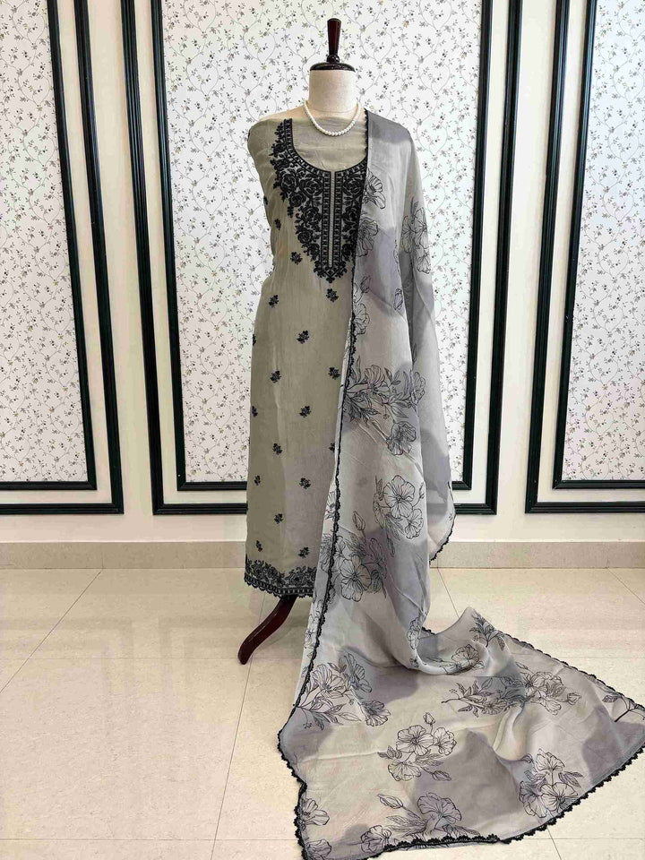 Grey organza suit set displayed on mannequin – The Zareesh