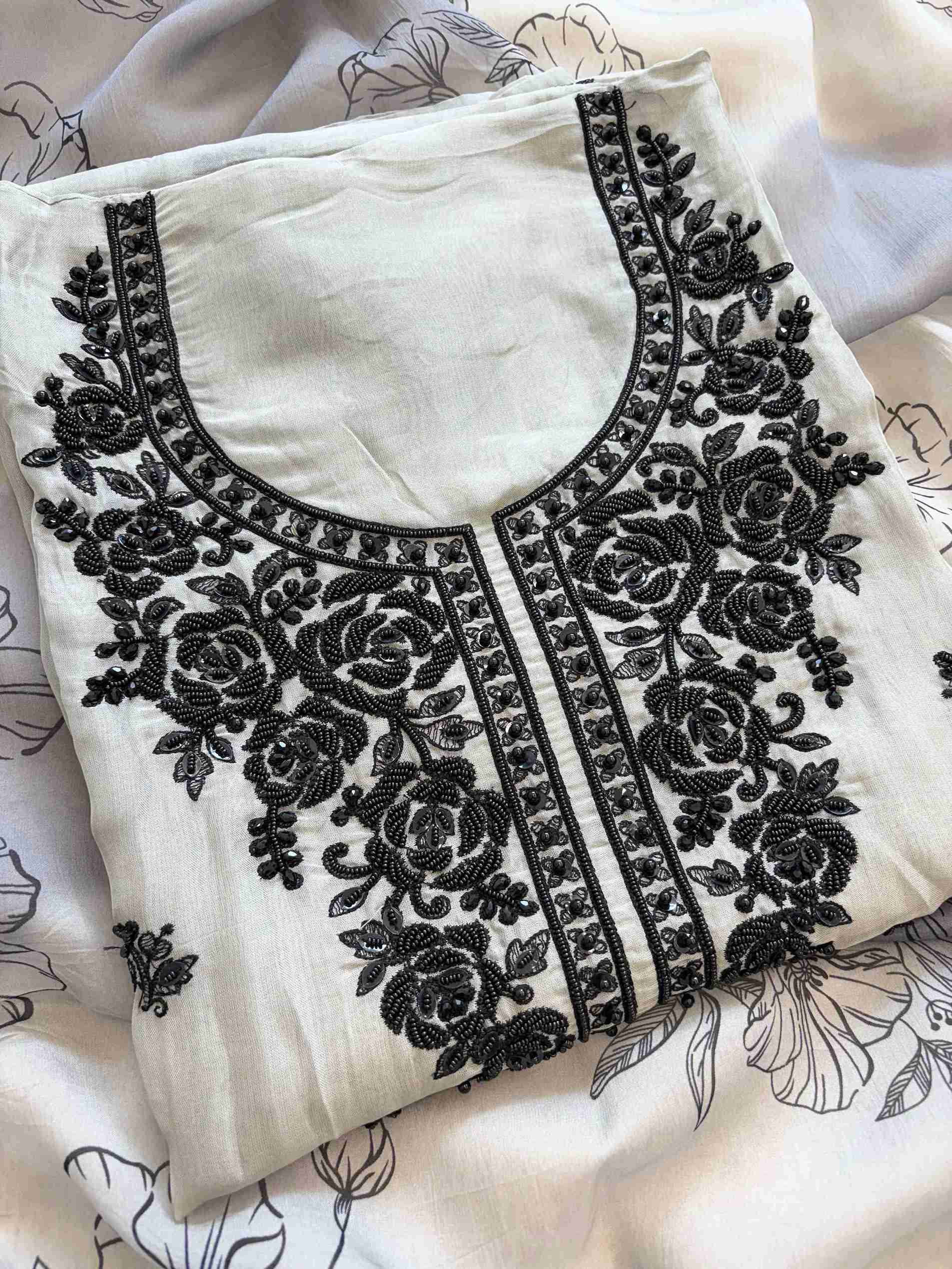 Grey organza unstitched suit with embroidered neckline and floral dupatta