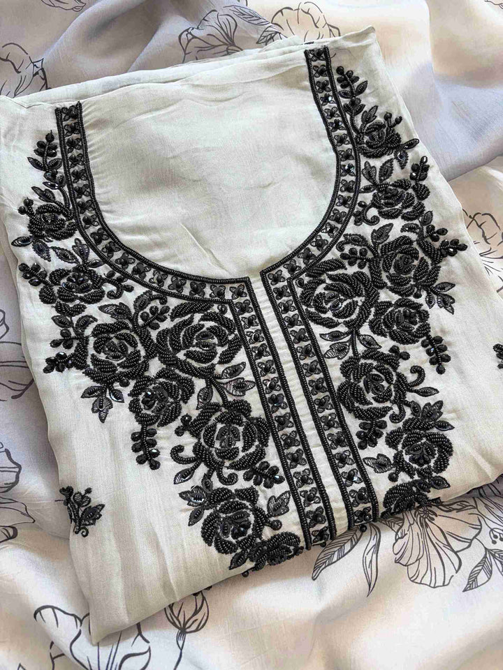 Grey organza unstitched suit with embroidered neckline and floral dupatta