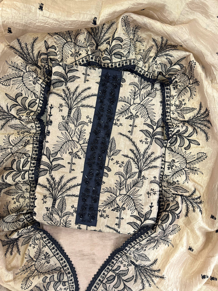 "Whispers of Nature: Beige Tissue Suit with Black Embroidery"