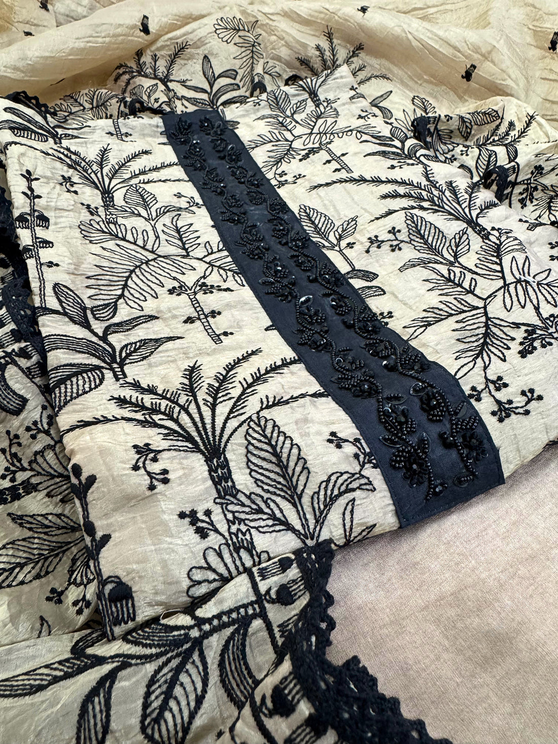 "Whispers of Nature: Beige Tissue Suit with Black Embroidery"