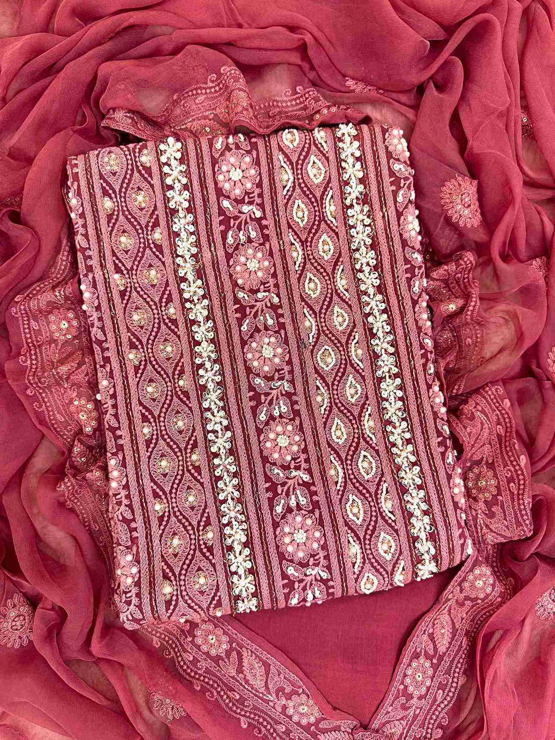 Chikankari unstitched suits on georgette fabric in red color with moti and sequence highlighting