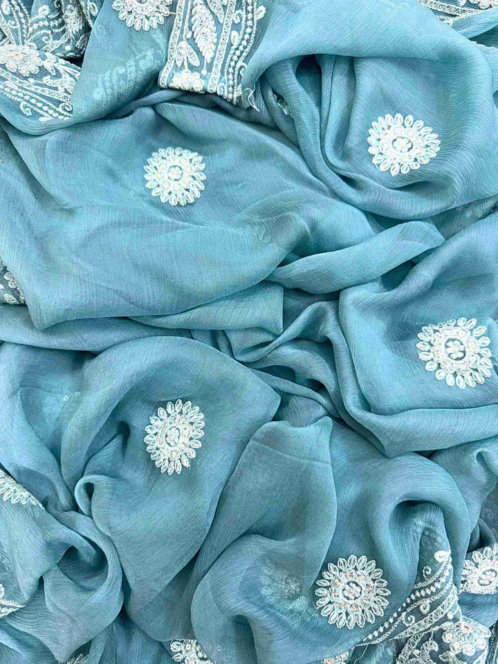 Chikankari unstitched suits on georgette fabric in teal color with moti and sequence highlighting