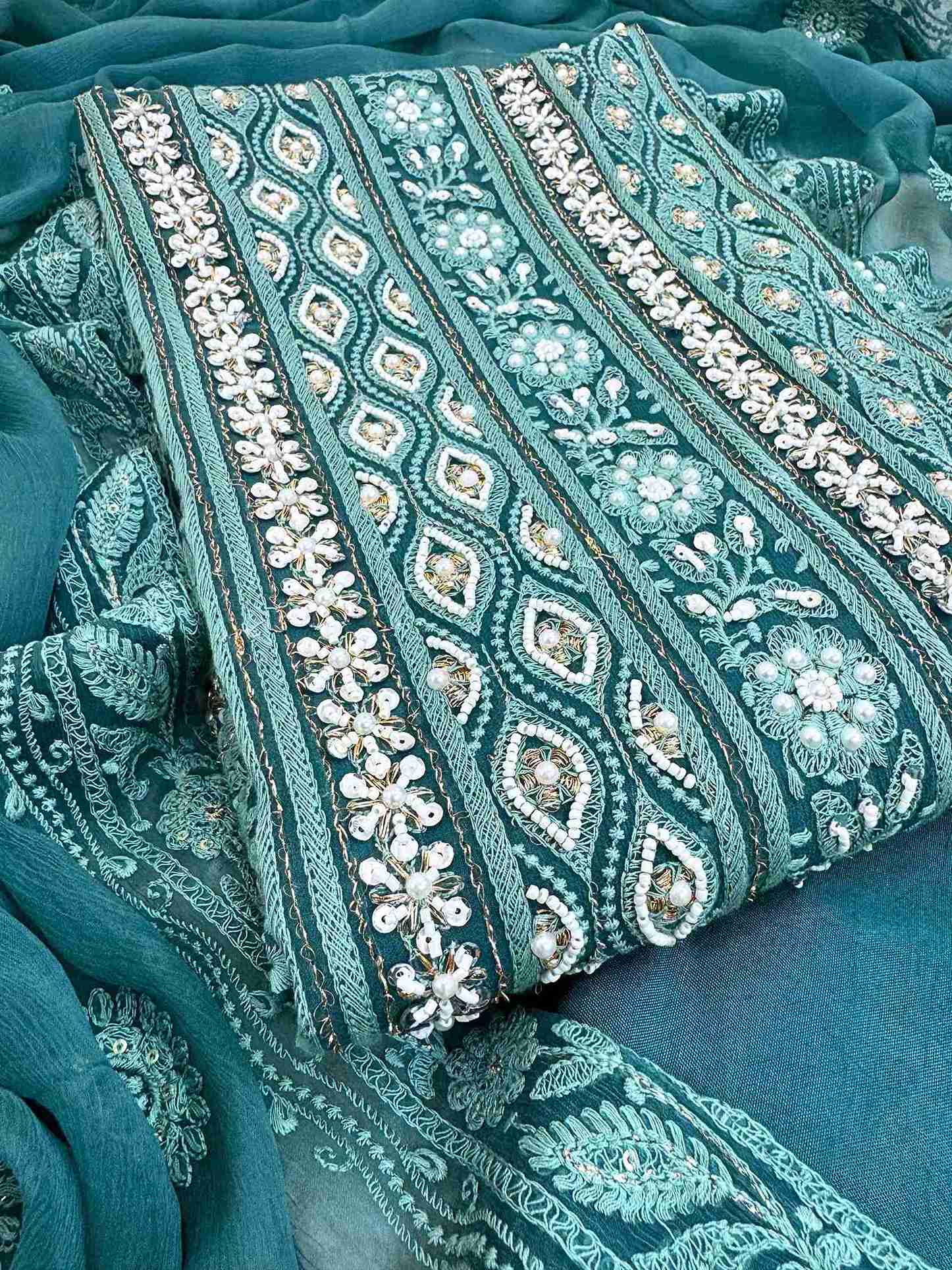 Chikankari unstitched suits on georgette fabric in teal color with moti and sequence highlighting