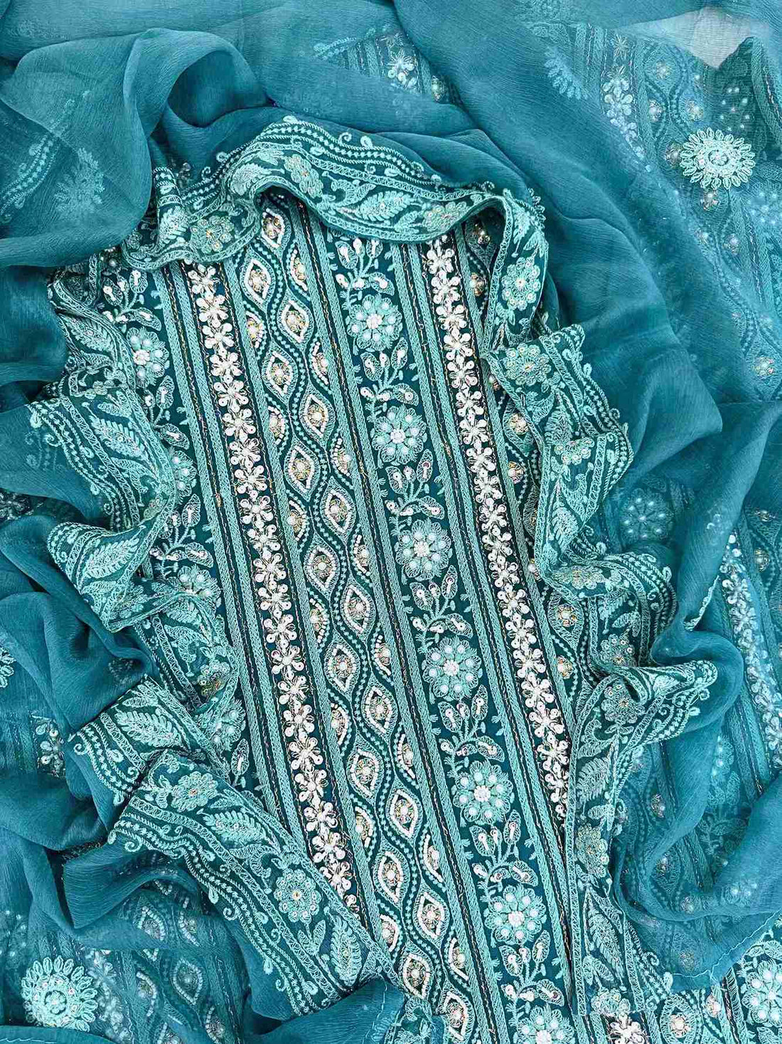Chikankari unstitched suits on georgette fabric in teal color with moti and sequence highlighting
