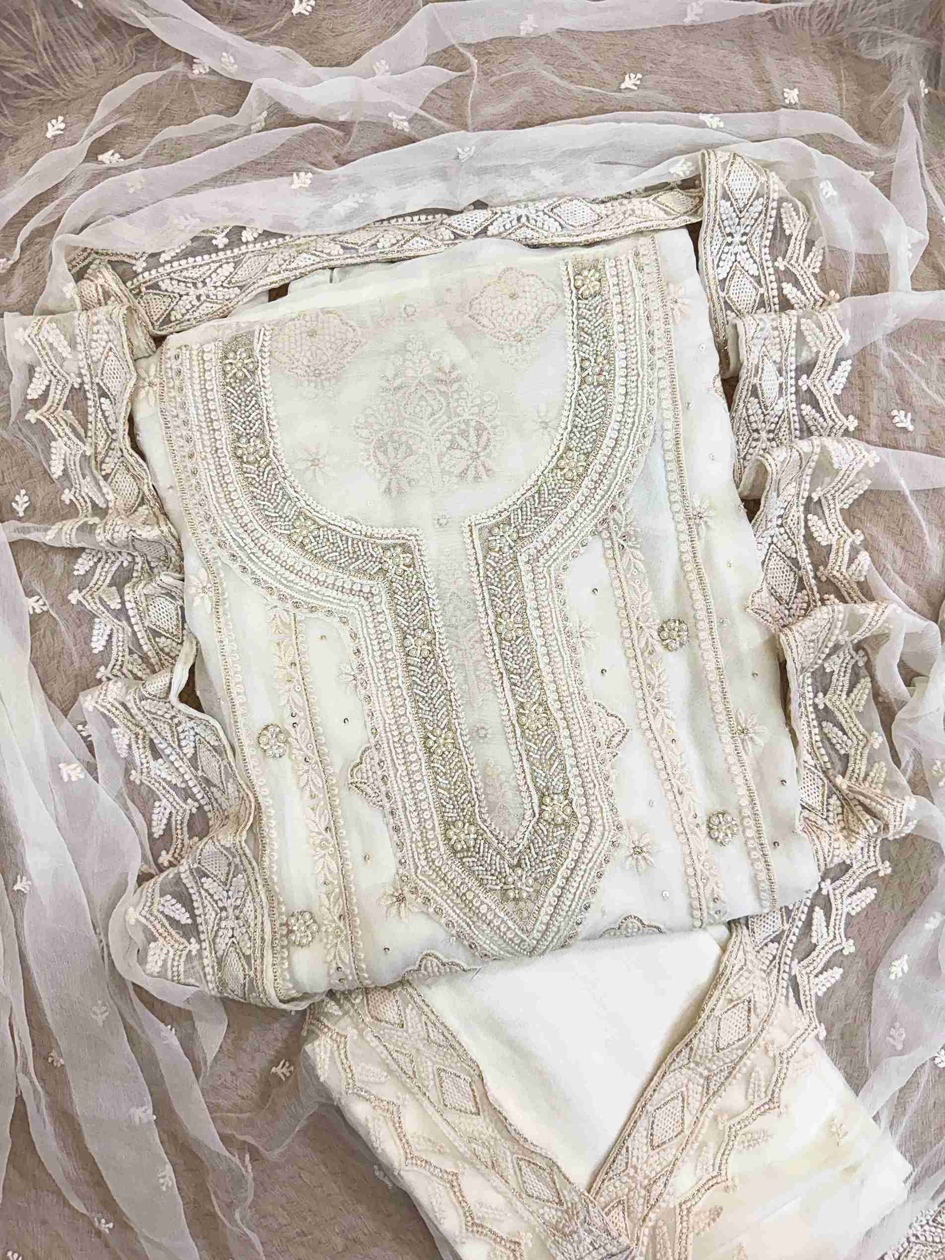 Ivory Radiance: Hand-Embroidered Suit with Pearl & Zari Highlights