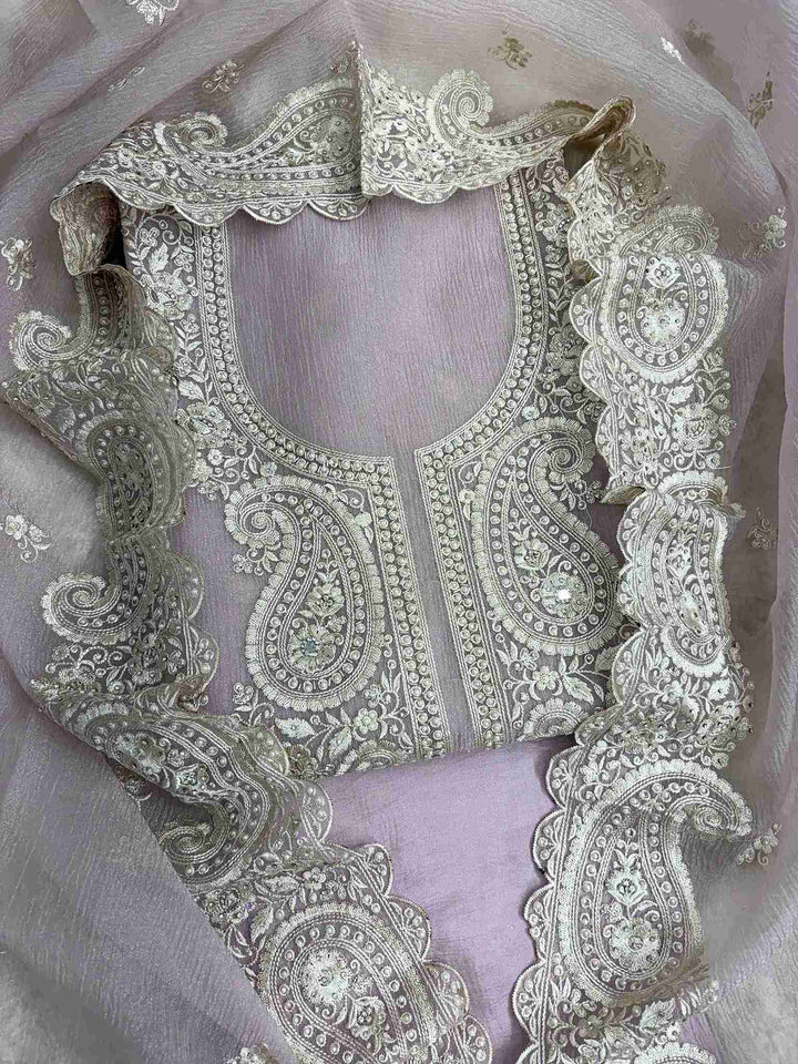Close-up of intricate paisley neckline with cutdana, sequins, and pearl embellishments on Pink marble chiffon shirt