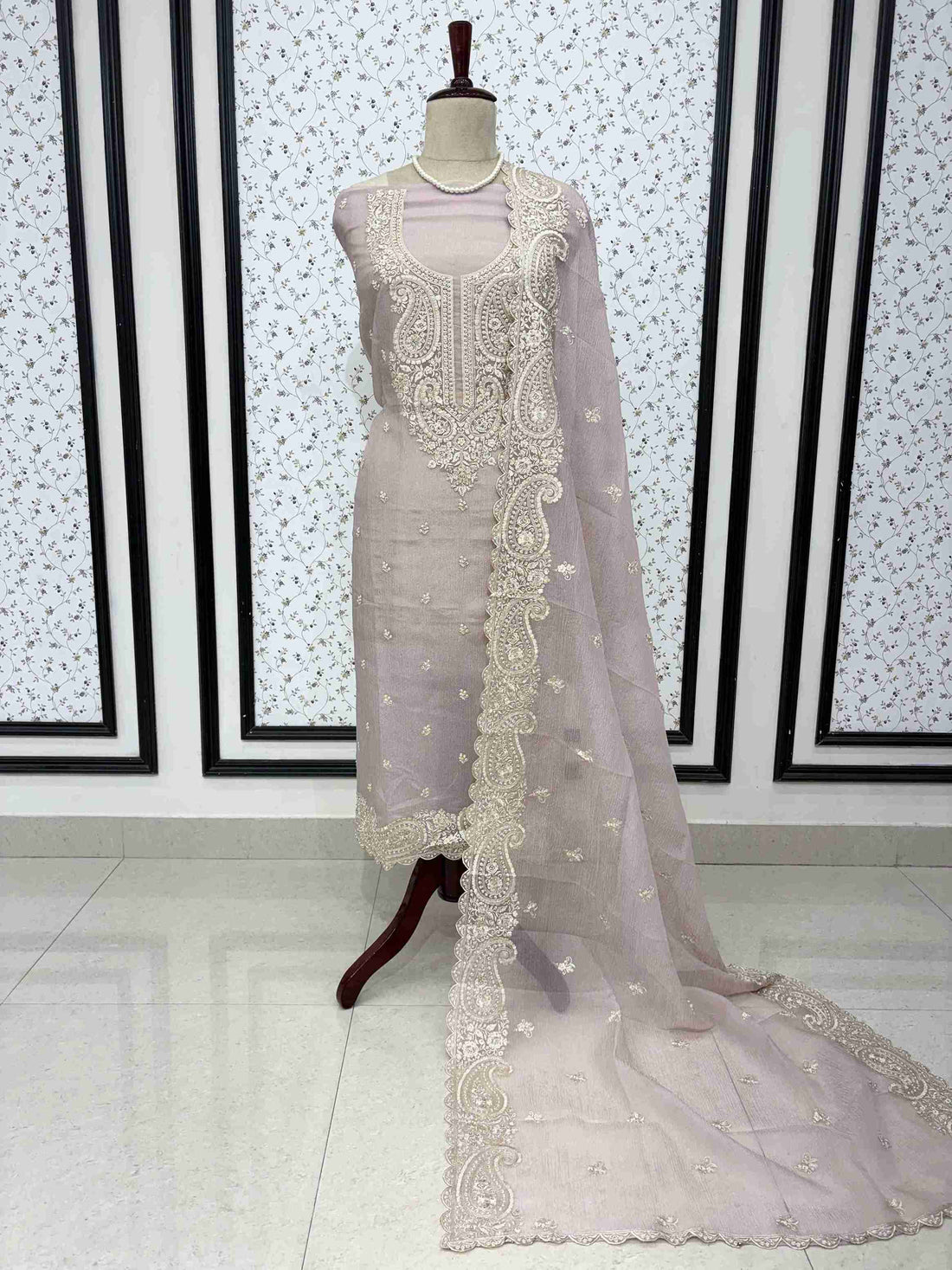 Pink marble chiffon unstitched suit full front view with paisley cutwork dupatta draped on mannequin