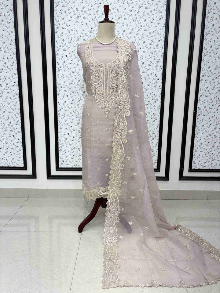 Pink marble chiffon unstitched suit full front view with paisley cutwork dupatta draped on mannequin