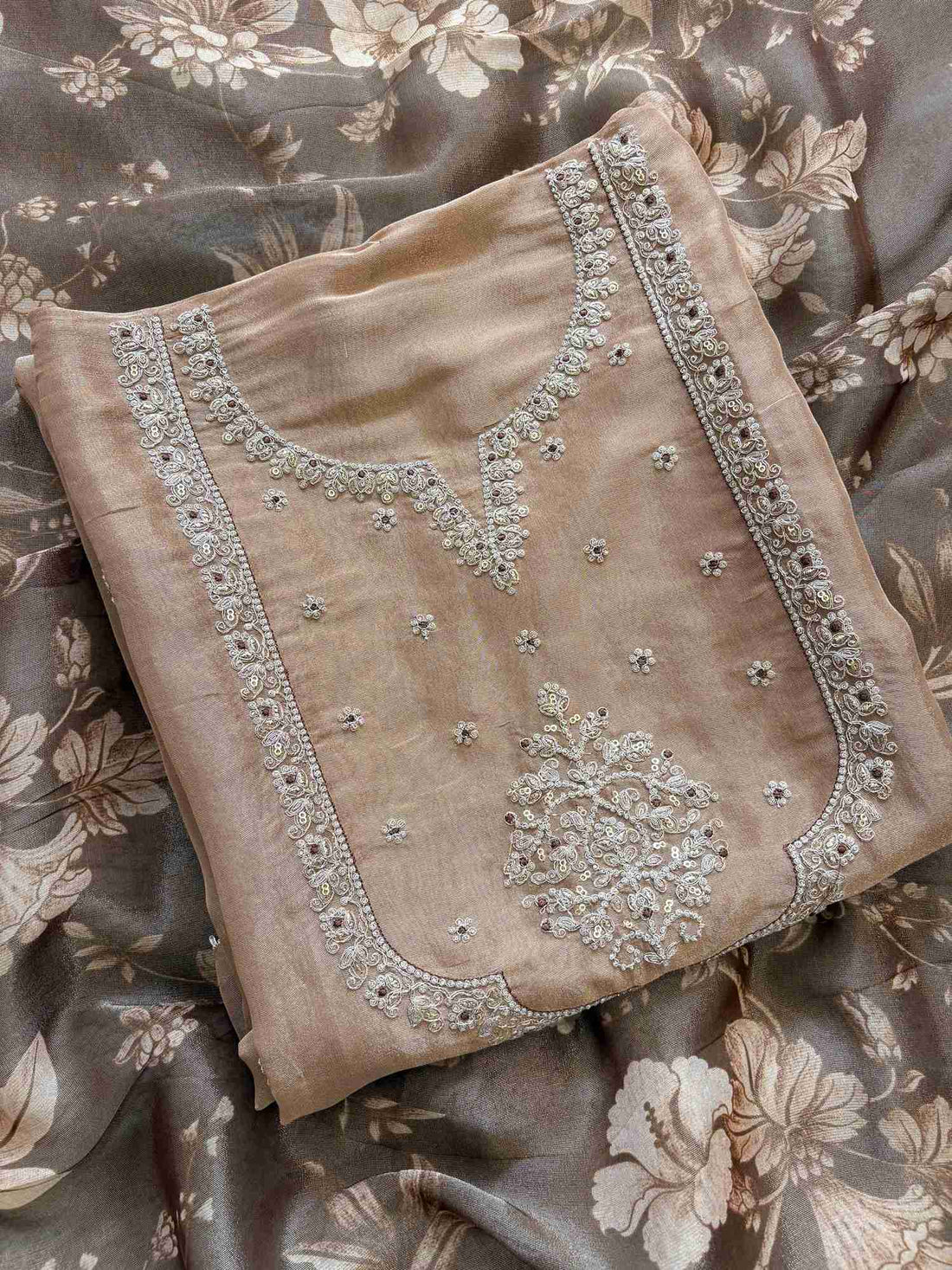 Premium gold organza dress material featuring delicate zari work and multicolour print dupatta