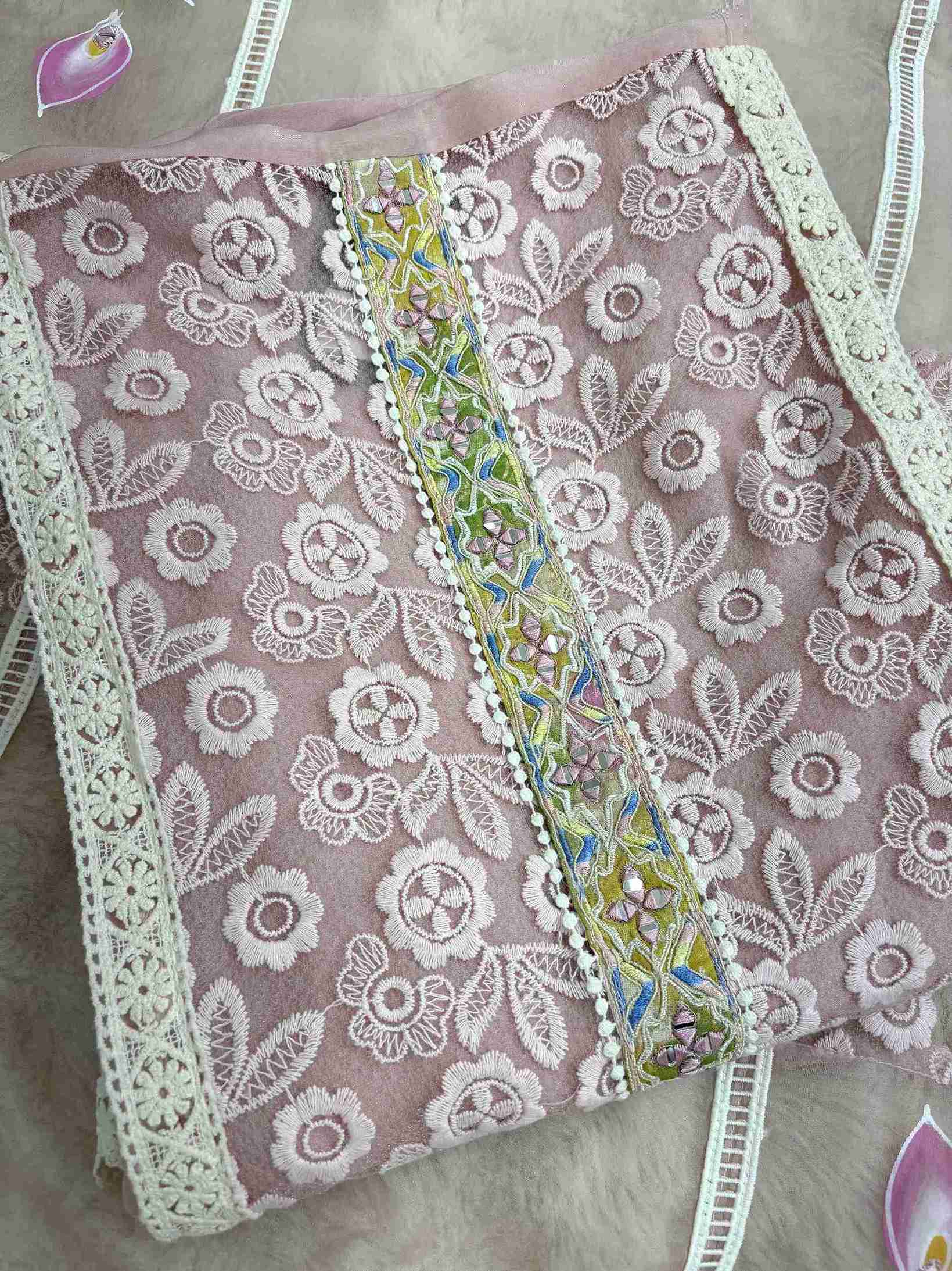 White lace panels running across the full length of pink organza shirt body