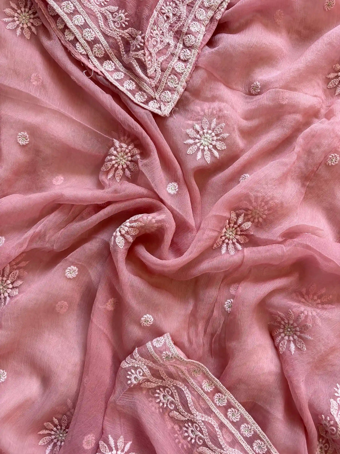 Powder pink georgette suit with moti highlighting and chiffon dupatta – embroidered festive ethnic wear for weddings and formal occasions.