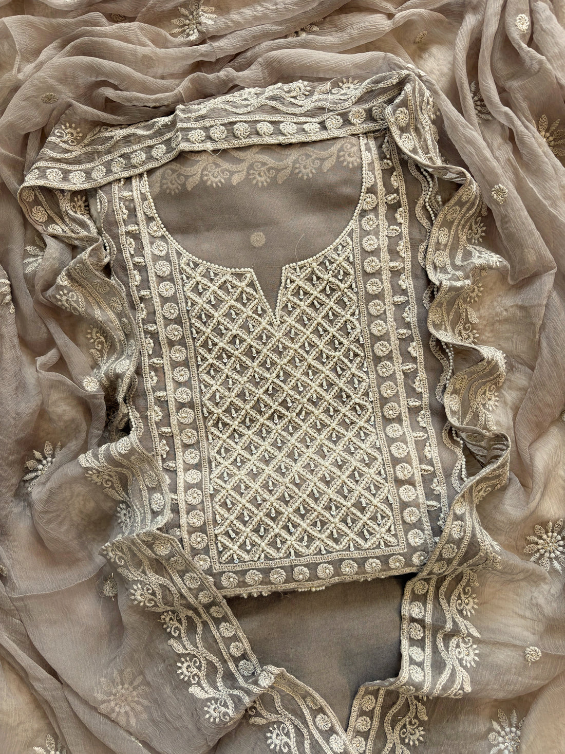 Powder brown georgette suit with moti highlighting and chiffon dupatta – embroidered festive ethnic wear for weddings and formal occasions.
