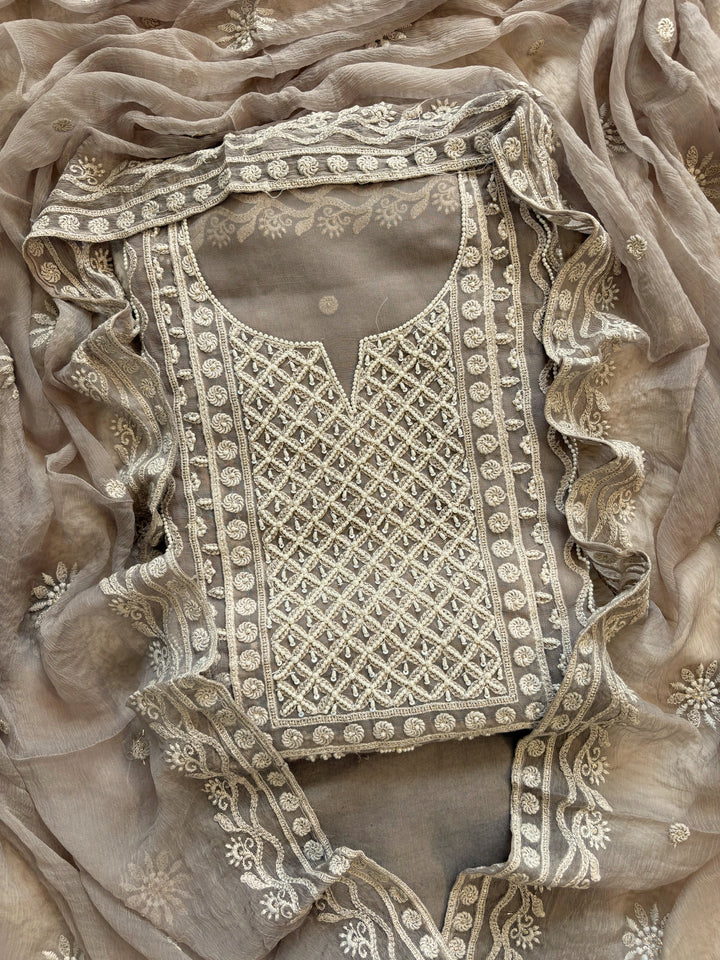 Powder brown georgette suit with moti highlighting and chiffon dupatta – embroidered festive ethnic wear for weddings and formal occasions.