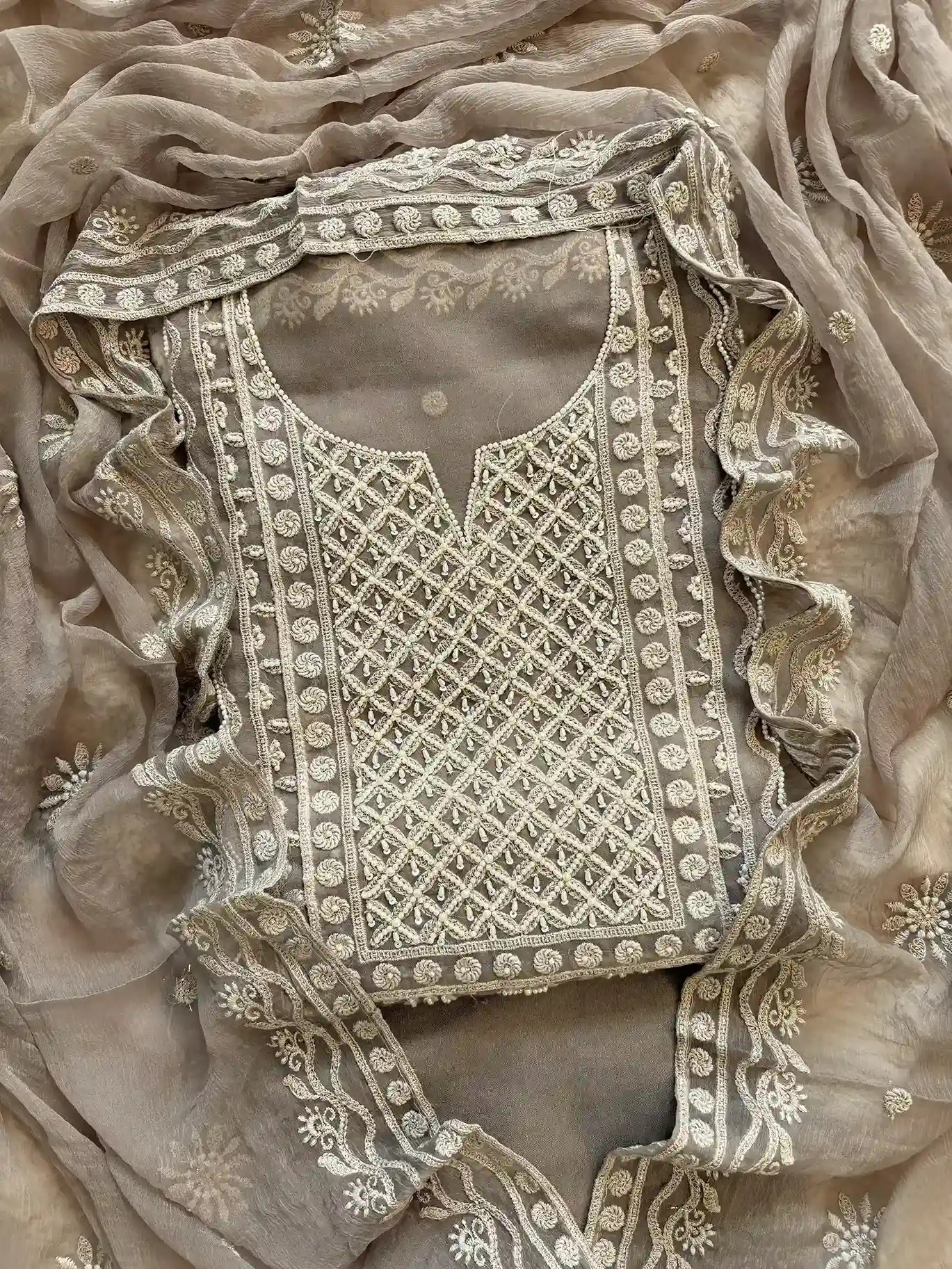 Powder brown georgette suit with moti highlighting and chiffon dupatta – embroidered festive ethnic wear for weddings and formal occasions.