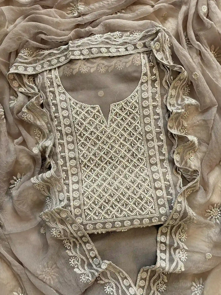 Powder brown georgette suit with moti highlighting and chiffon dupatta – embroidered festive ethnic wear for weddings and formal occasions.