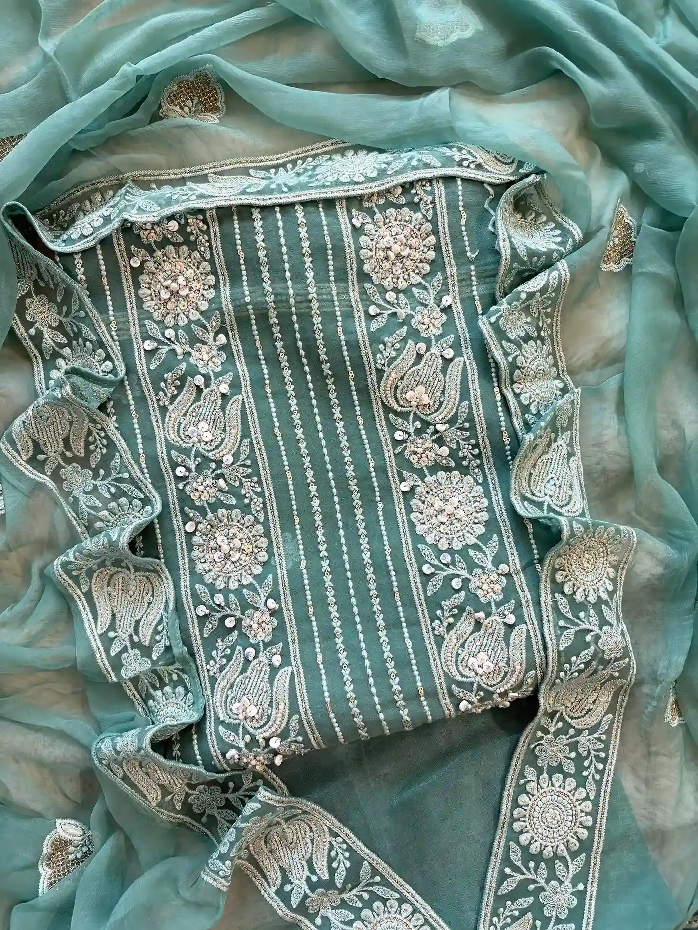 aqua green party wear chikankari unstiched suit with moti and sequence embellishments