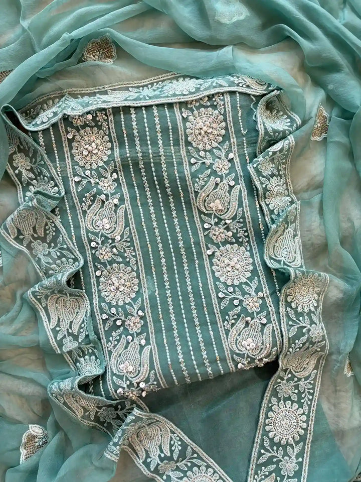 aqua green party wear chikankari unstiched suit with moti and sequence embellishments