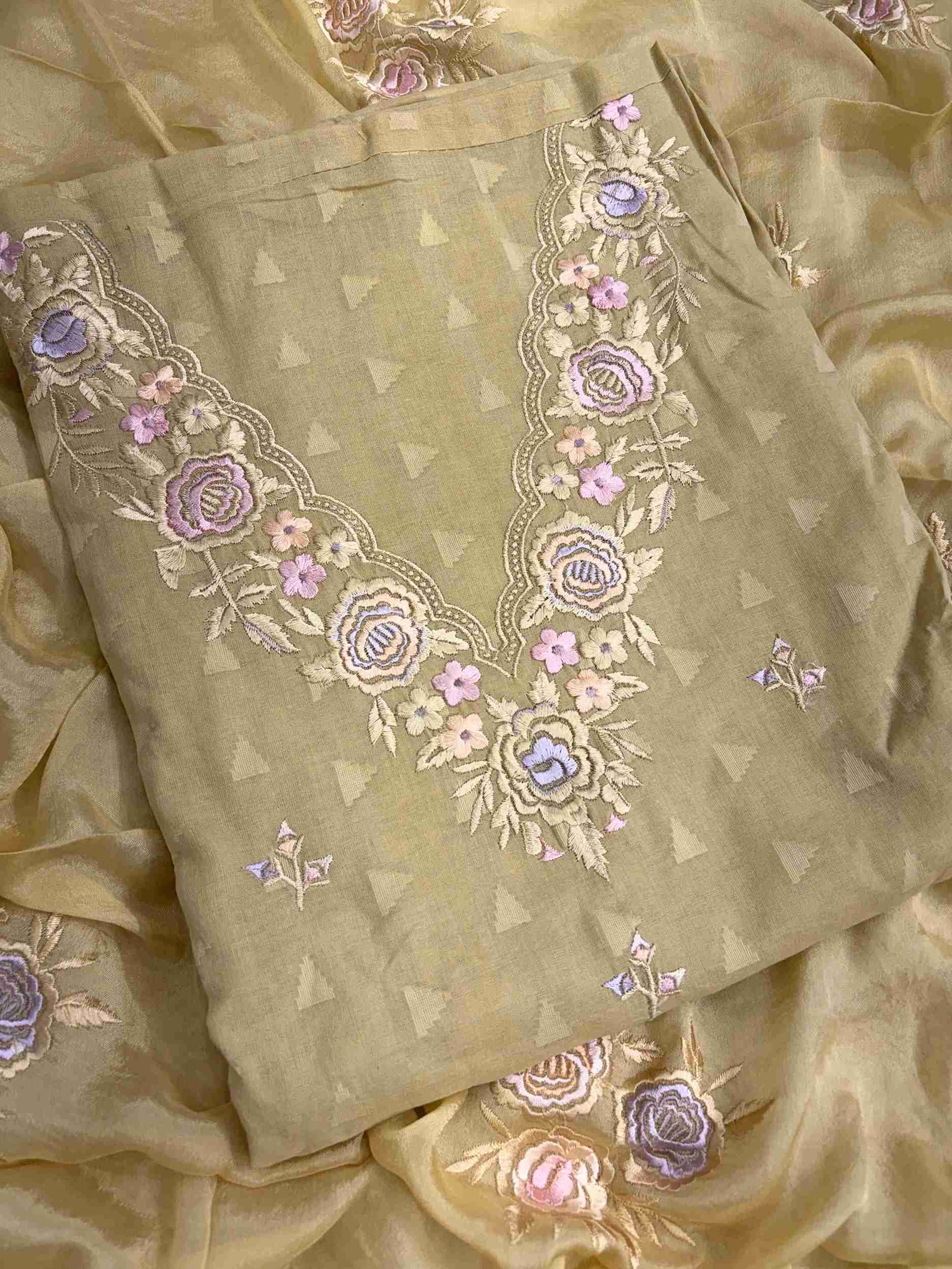 Floral thread embroidered V neckline on antique gold cotton suit with jacquard impression