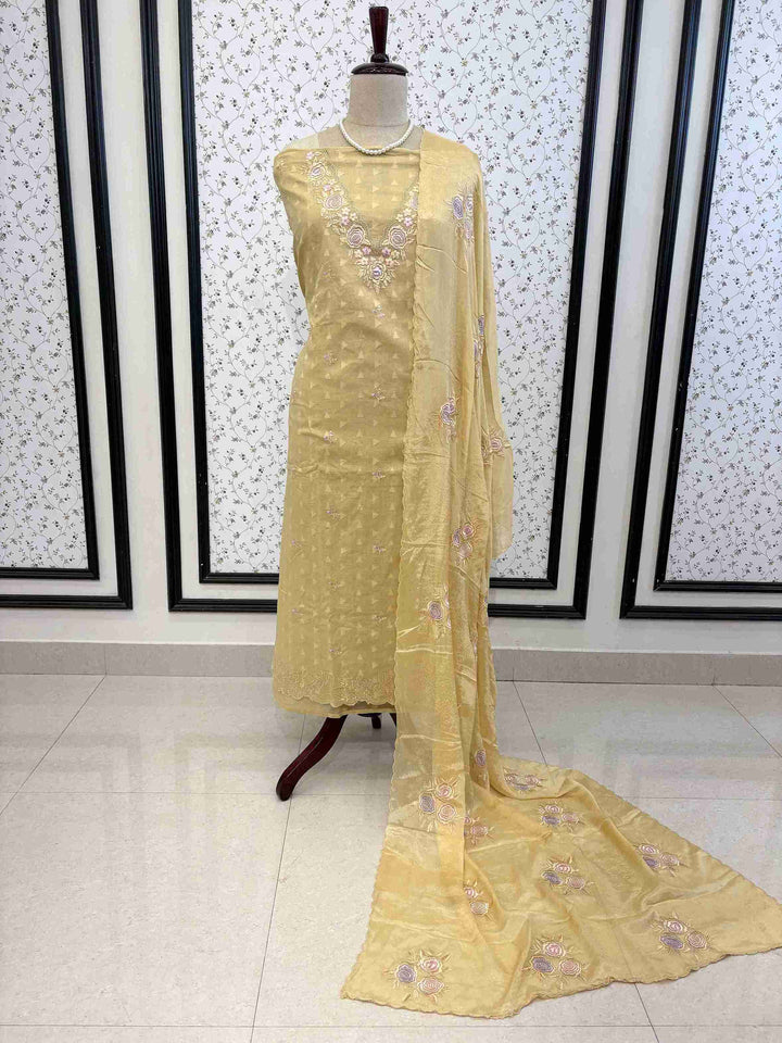 Elegant antique gold cotton unstitched suit set with embroidered chinnon dupatta on manequinn
