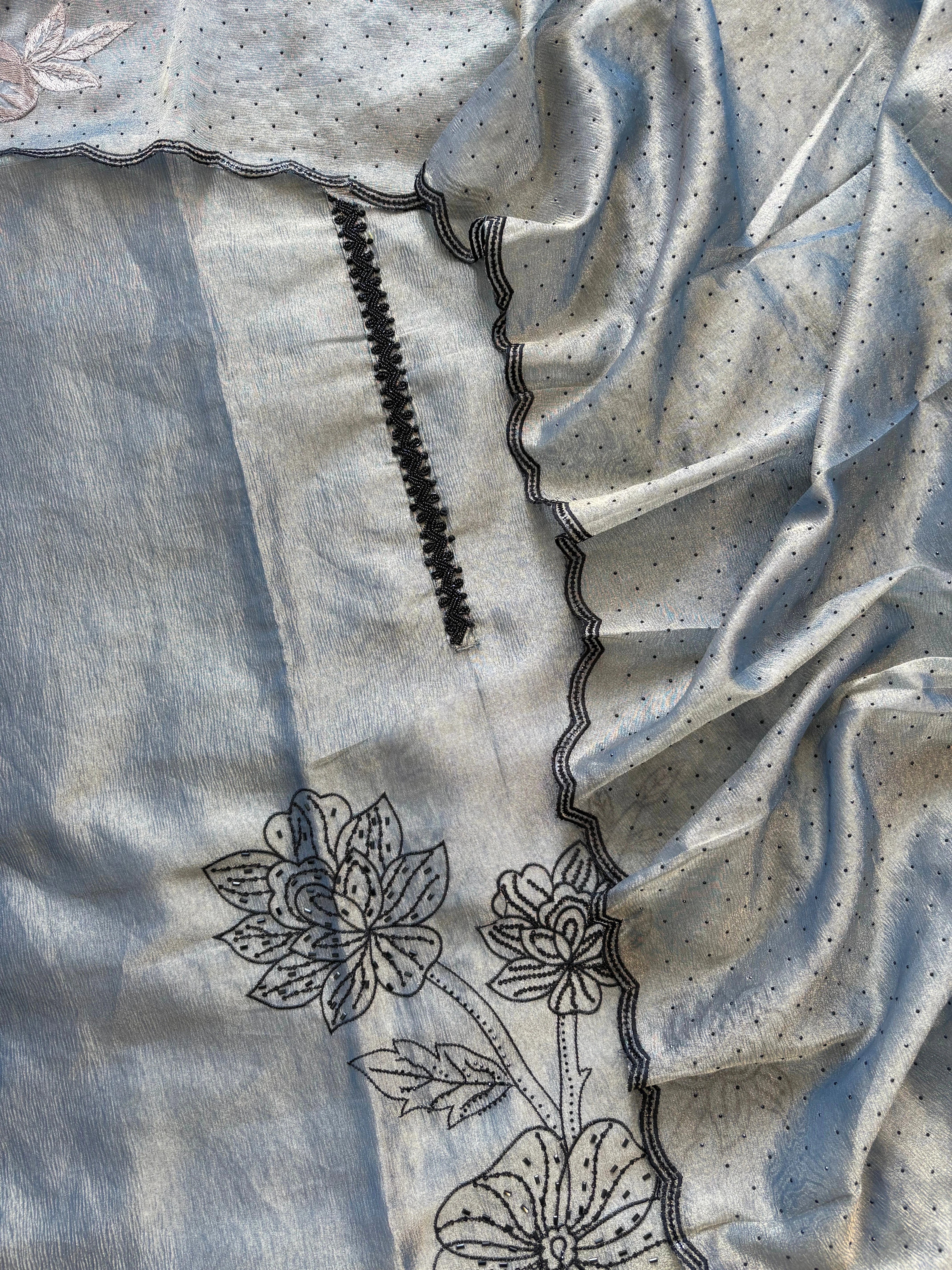 Grey glass tissue suit with intricate embroidery and organza dupatta – luxury ethnic wear for weddings and festive occasions.