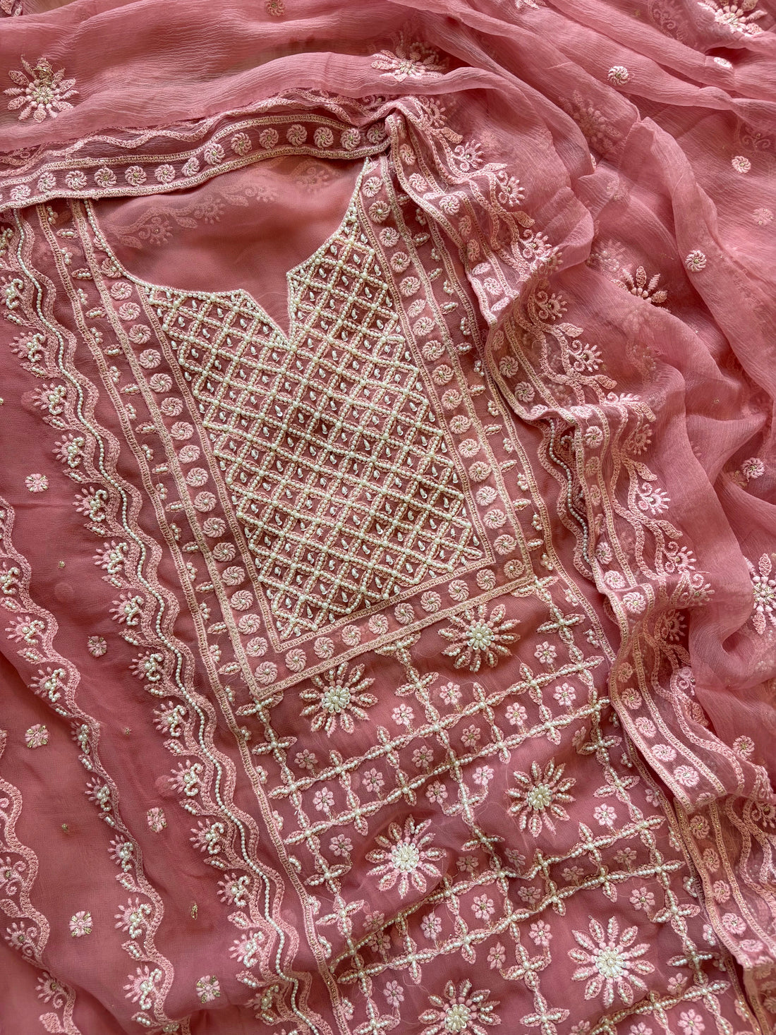 Powder pink georgette suit with moti highlighting and chiffon dupatta – embroidered festive ethnic wear for weddings and formal occasions.