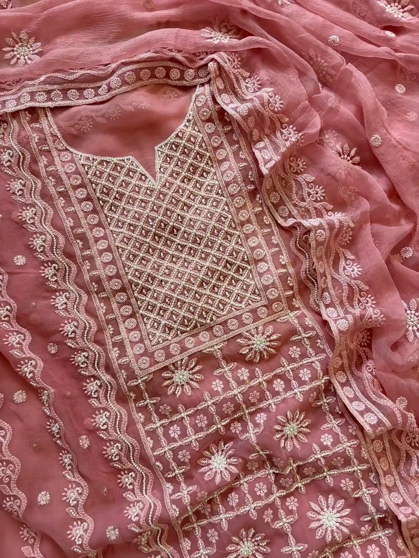 Powder pink georgette suit with moti highlighting and chiffon dupatta – embroidered festive ethnic wear for weddings and formal occasions.