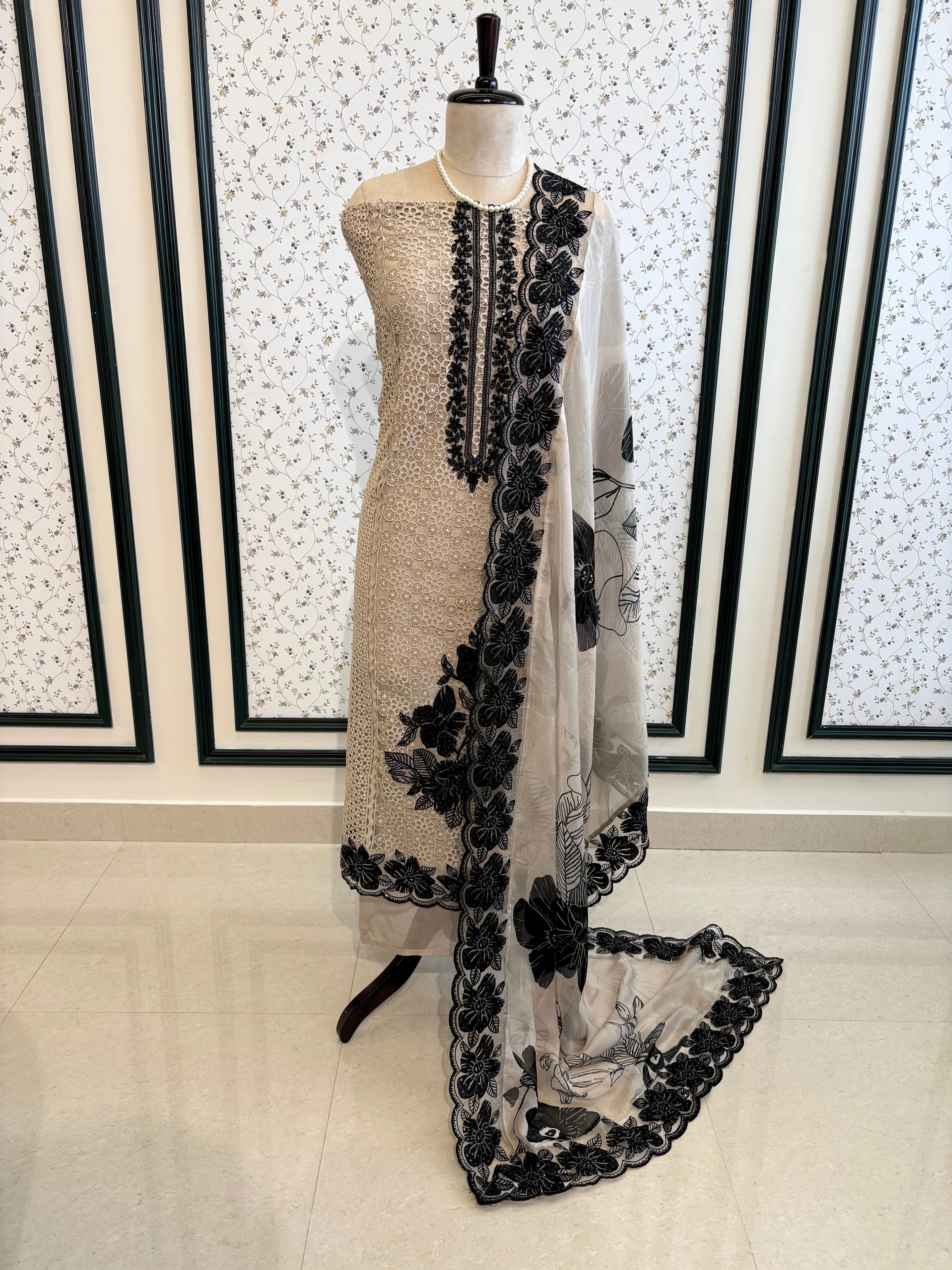 Ivory unstitched cutwork shirt with black applique embroidery and lace detailing, festive ethnic wear fabric