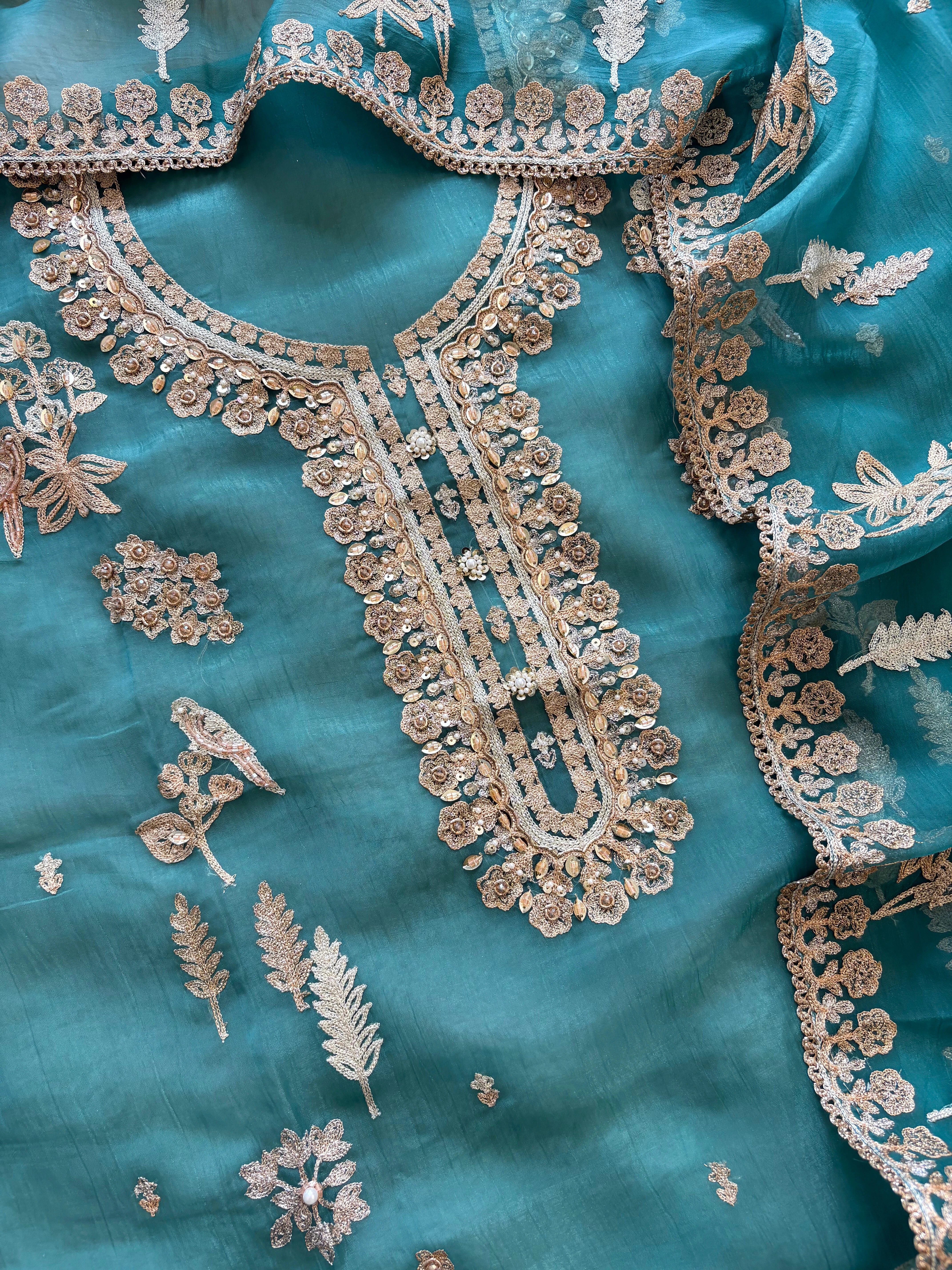 organza unstitched suit with zari work and parrot figure