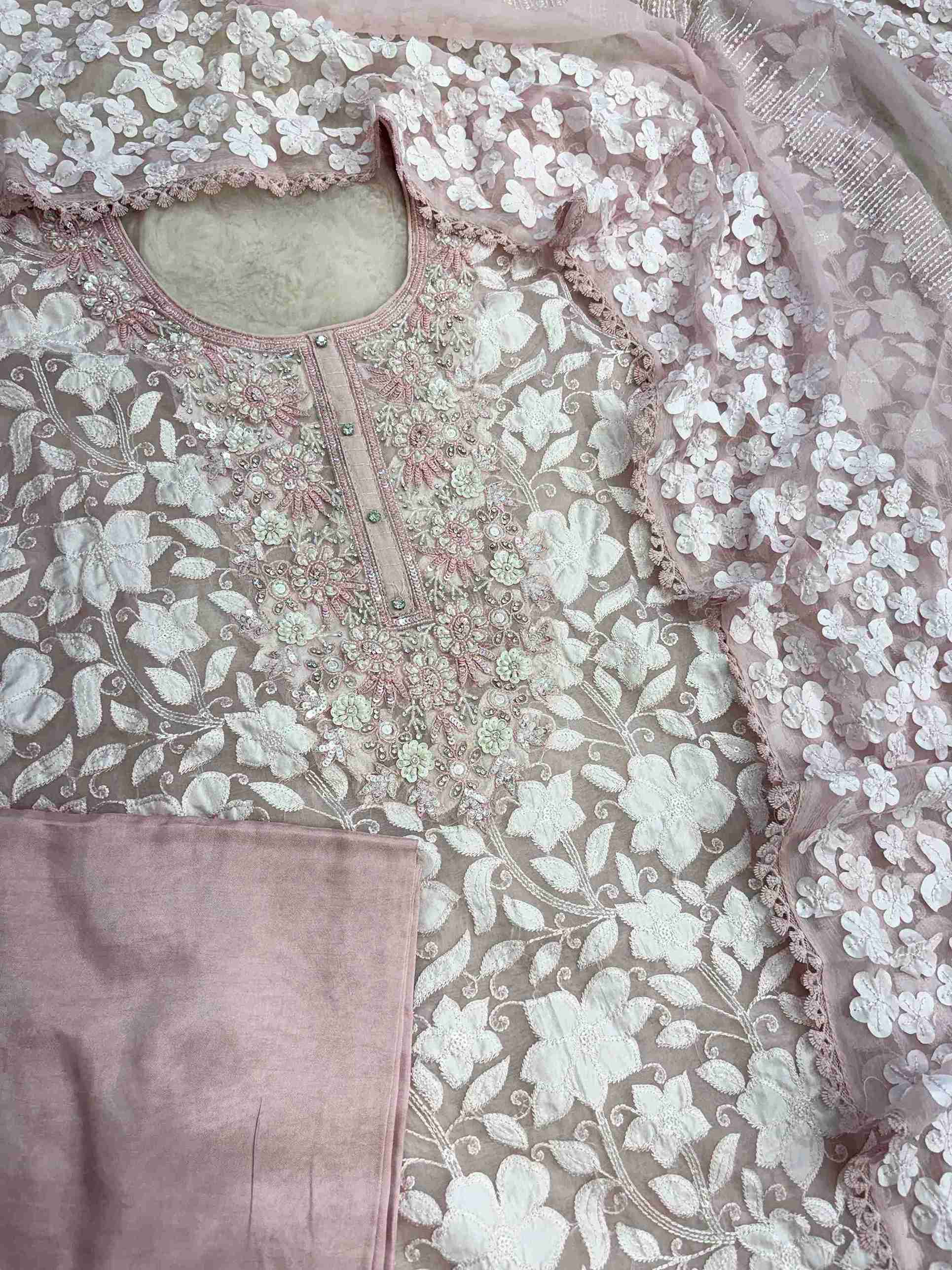 Complete baby pink organza unstitched suit flat lay set with shirt, chiffon dupatta, and opada silk bottom