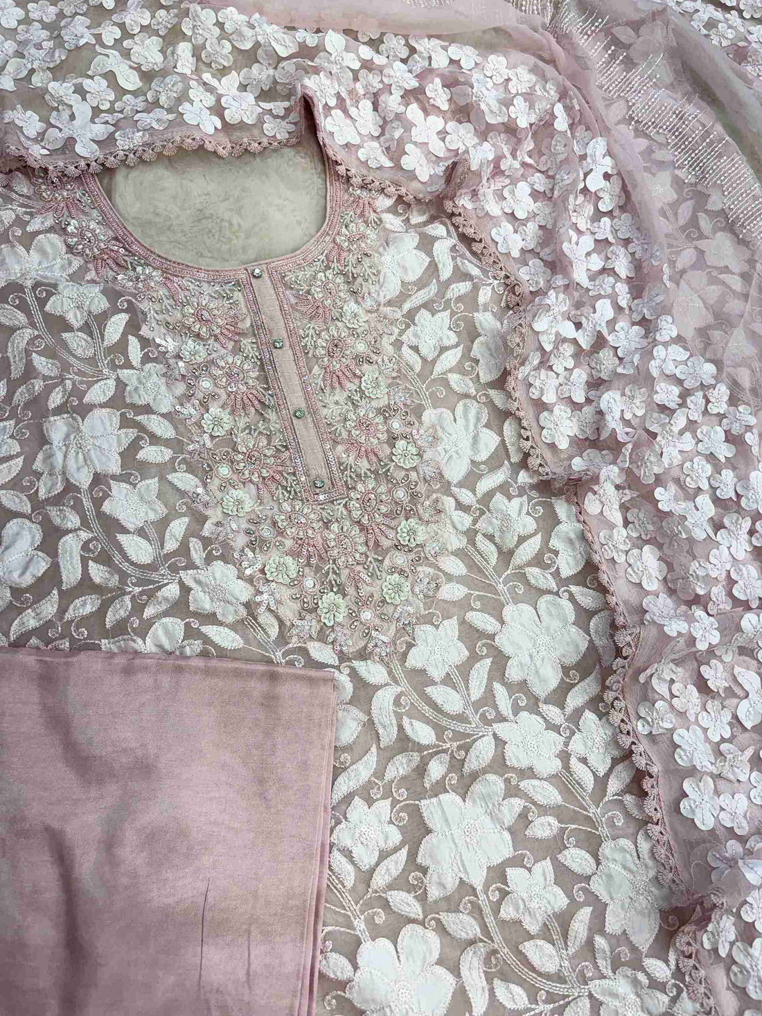 Complete baby pink organza unstitched suit flat lay set with shirt, chiffon dupatta, and opada silk bottom