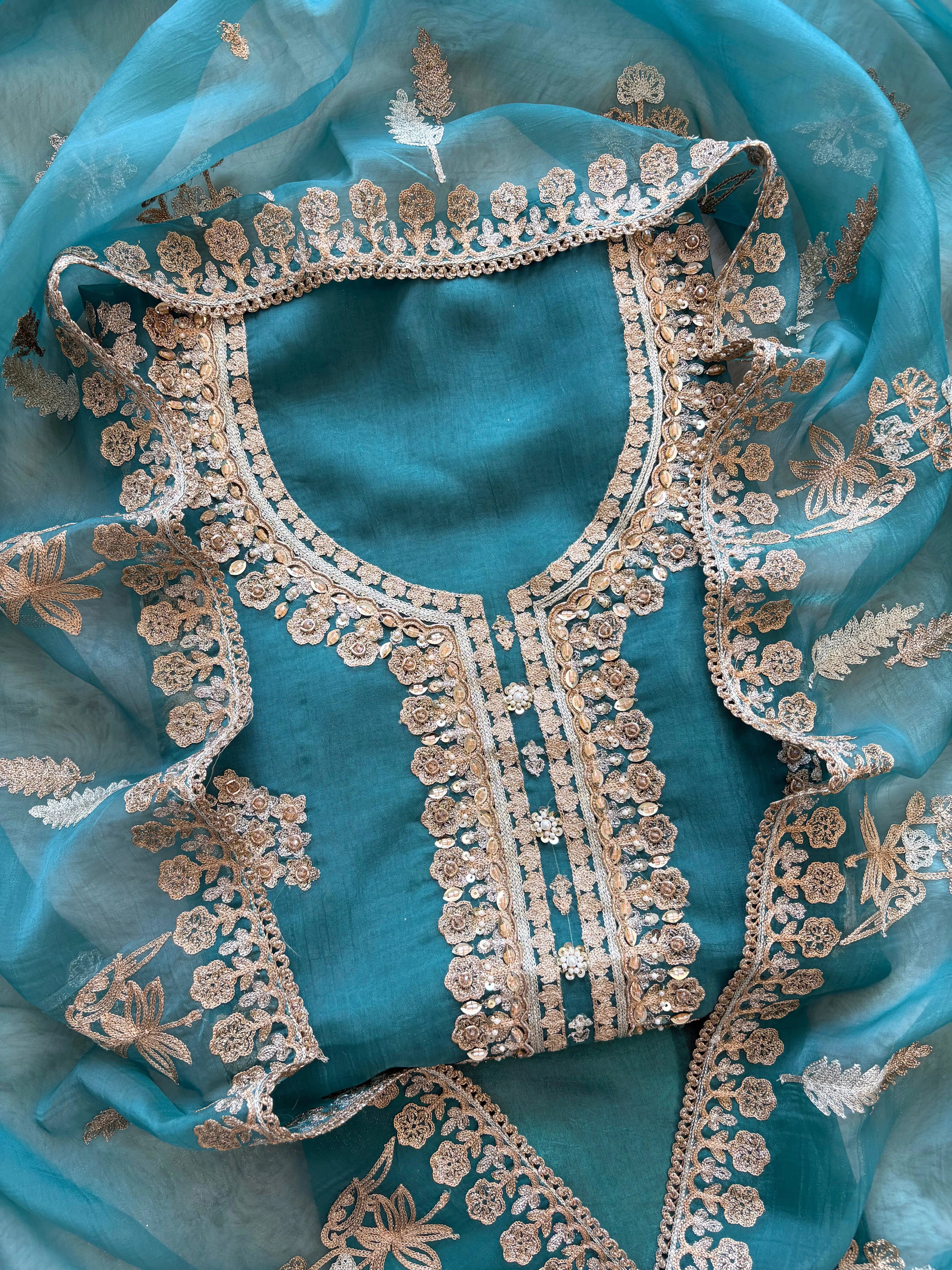 Noor-e-Zareen: Teal Blue Glass Tissue Suit with Zari Embroidery
