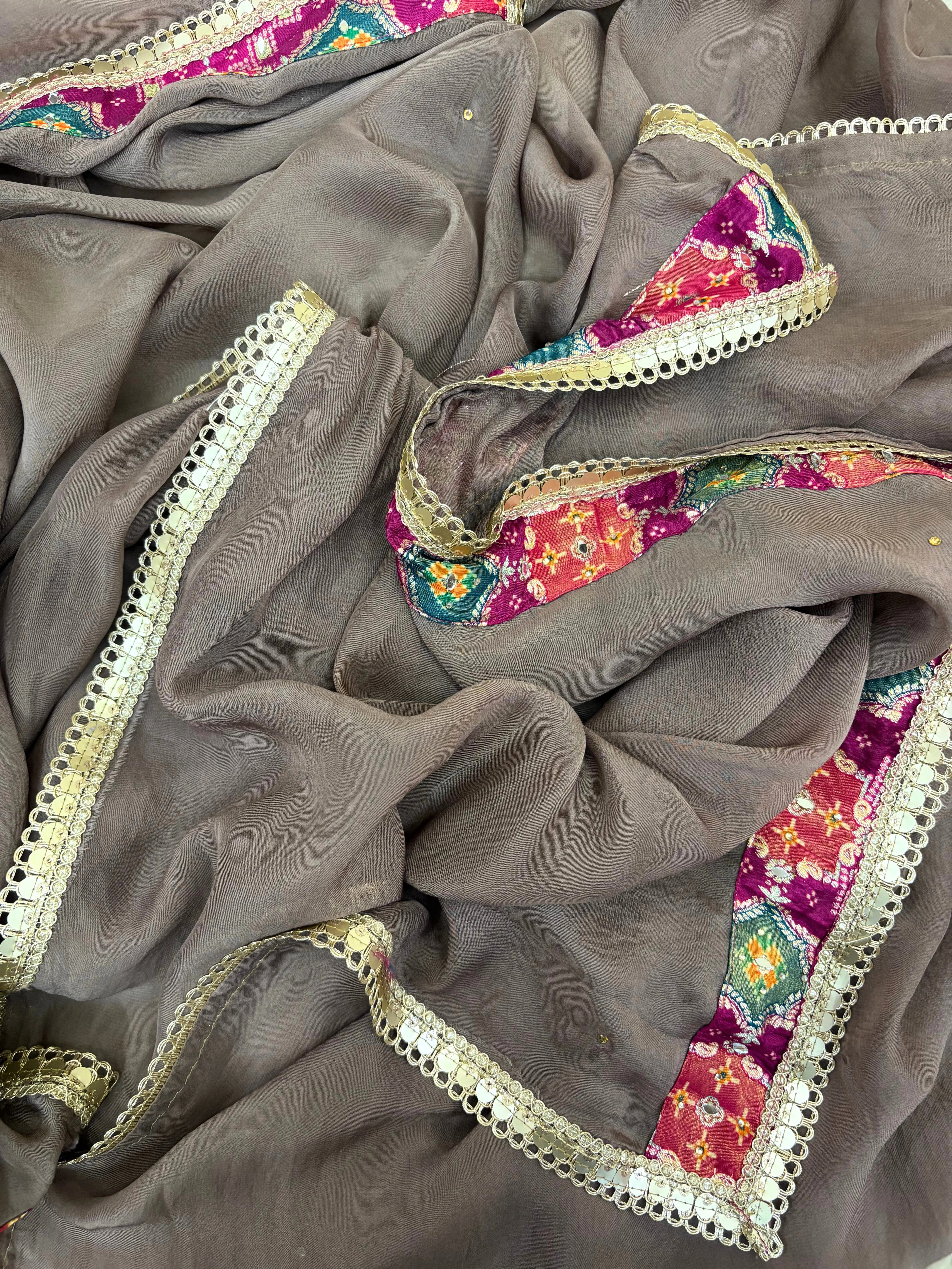 Taupe brown organza unstitched suit with mirror work, sequin embroidery, and magenta contrast neckline patch, paired with mirror lace organza dupatta – festive ethnic wear