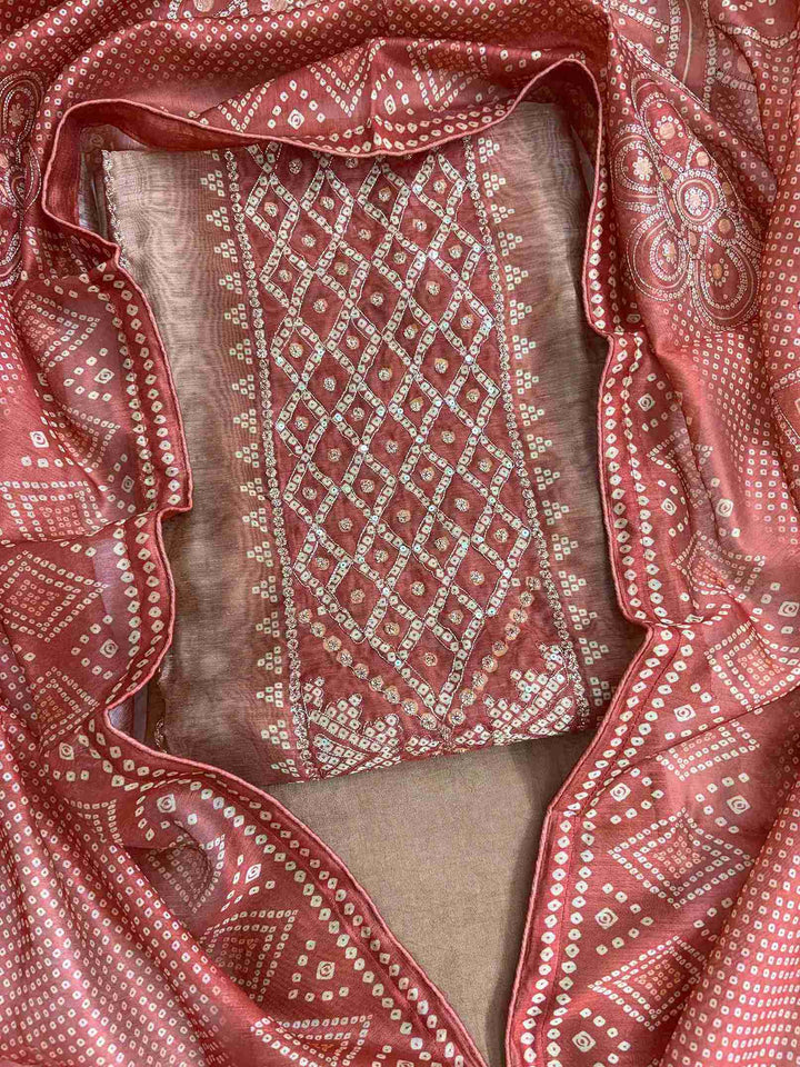 Close-up of all-over bandhni print with zari thread work detailing on beige chanderi silk shirt