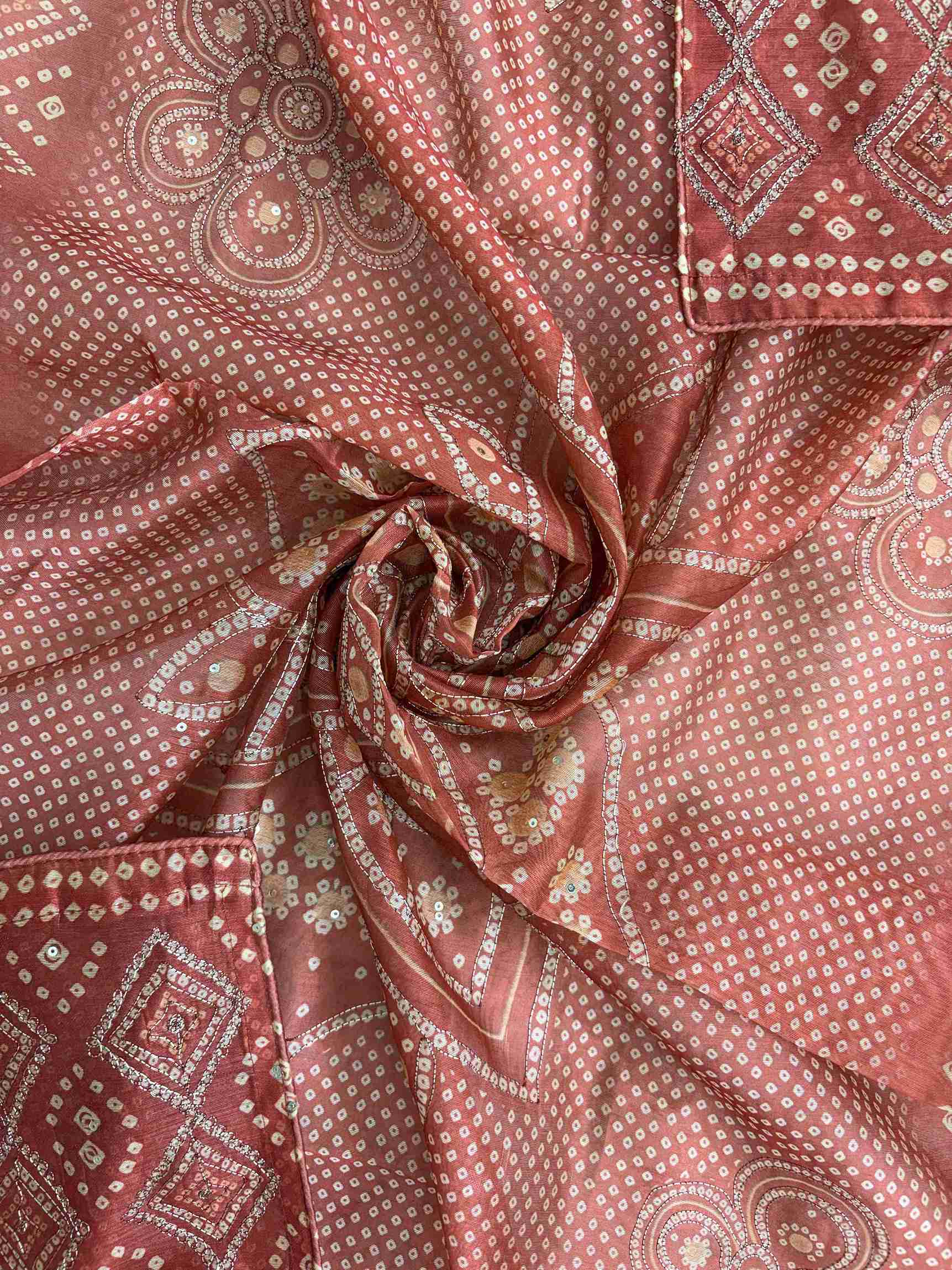 All-over bandhni print with medallion and geometric motifs on red chanderi silk dupatta