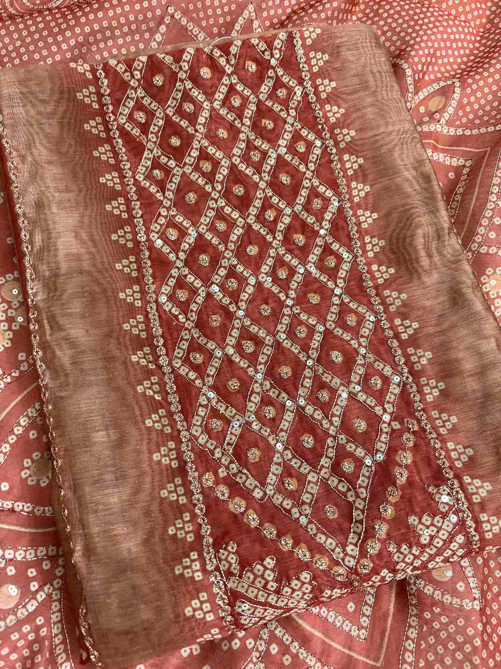 Contrasting red neckline border detail on beige bandhni chanderi silk shirt