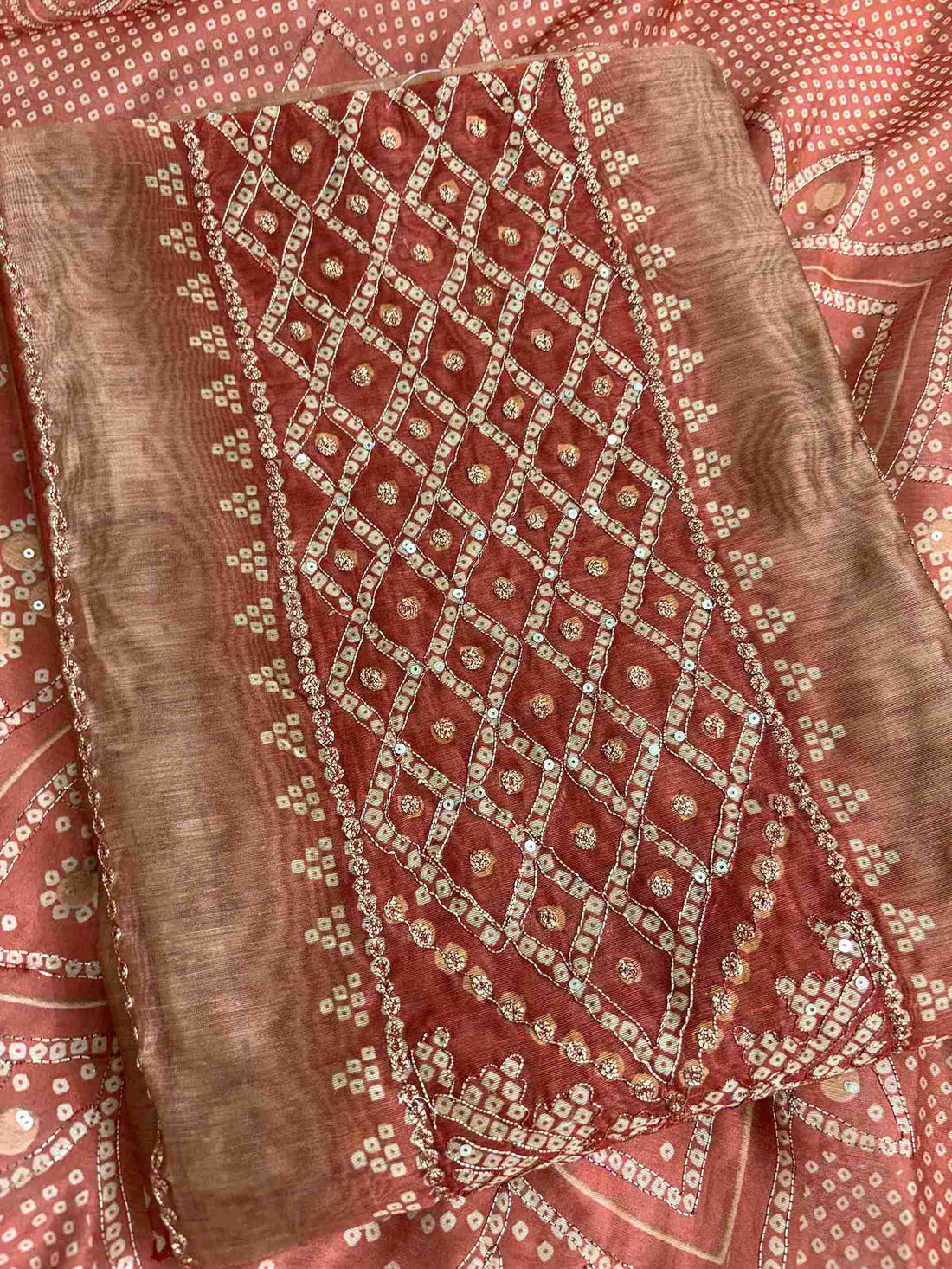 Contrasting red neckline border detail on beige bandhni chanderi silk shirt
