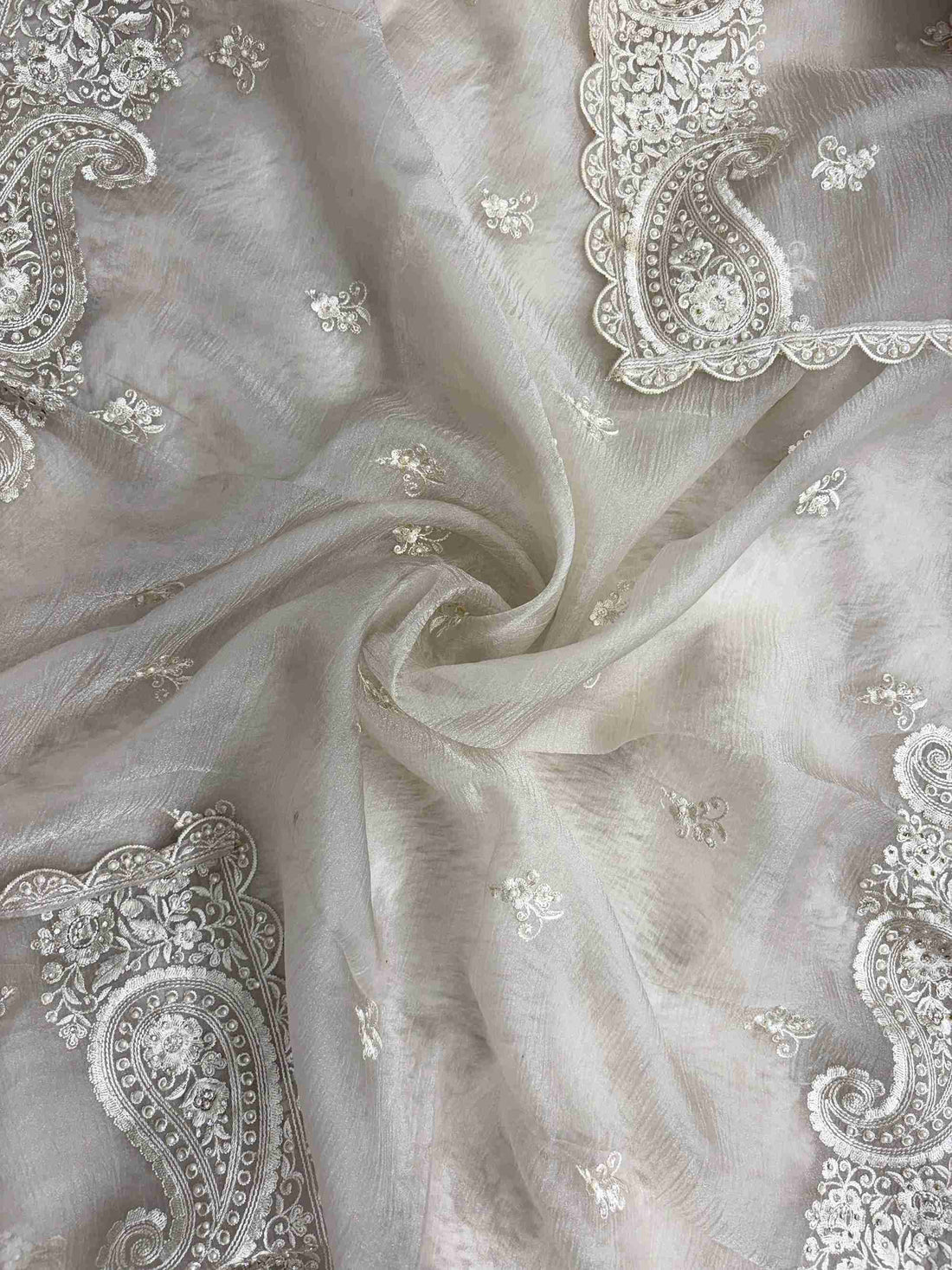 Paisley cutwork border with scalloped finishing along beige marble chiffon dupatta edge