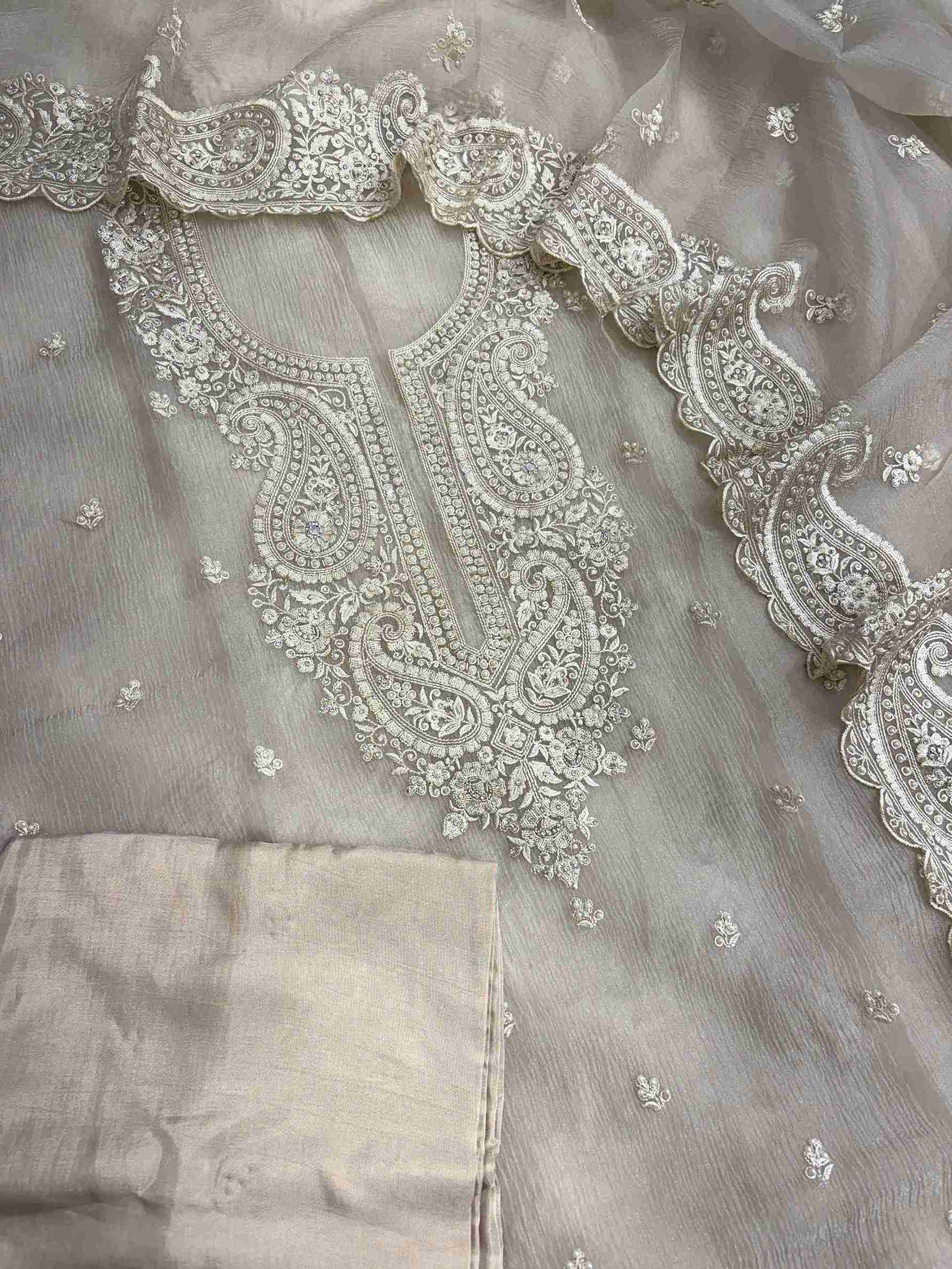 Complete beige marble chiffon unstitched suit flat lay set with shirt, dupatta, and opada silk bottom